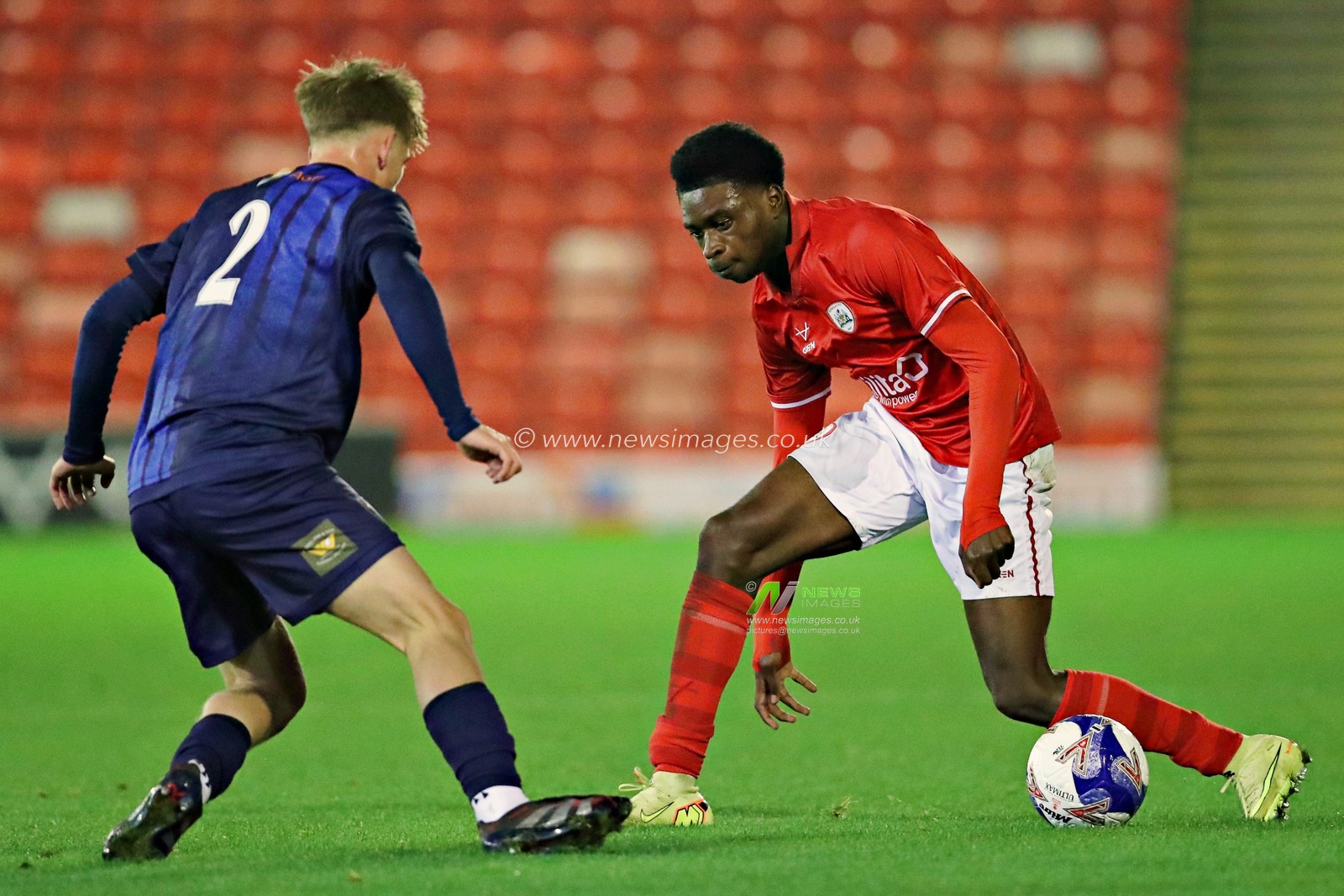 Charlie Cheetham of Mansfield Town U18's pressures Chris Ogbu of Barnsley FC U18s during the FA Youth Cup U18’s round 2 match Barnsley vs Mansfield Town at Oakwell, Barnsley, United Kingdom, 17th November 2025(Photo by Sam Eaden/News Images)