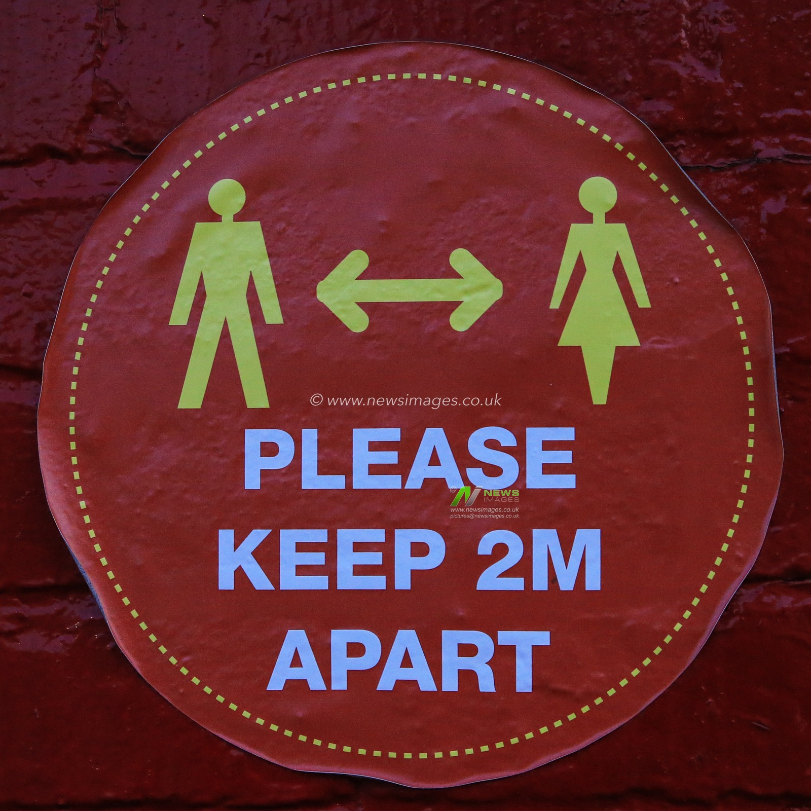 A covid distancing sticker outside the media entrance at Oakwell