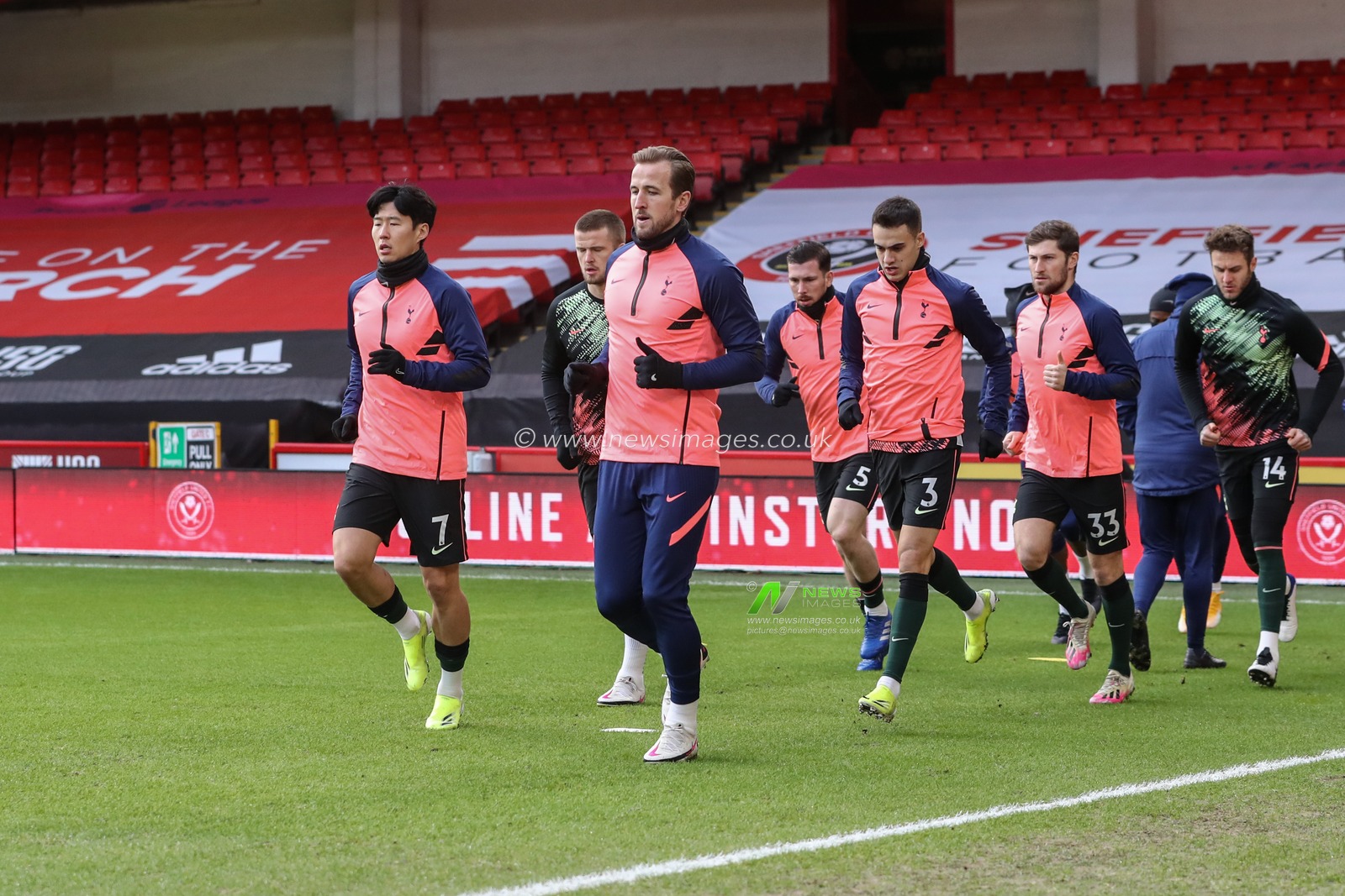 Harry Kane #10 of Tottenham Hotspur and Son Heung-Min #7 of Tottenham Hotspur warming up with team mates