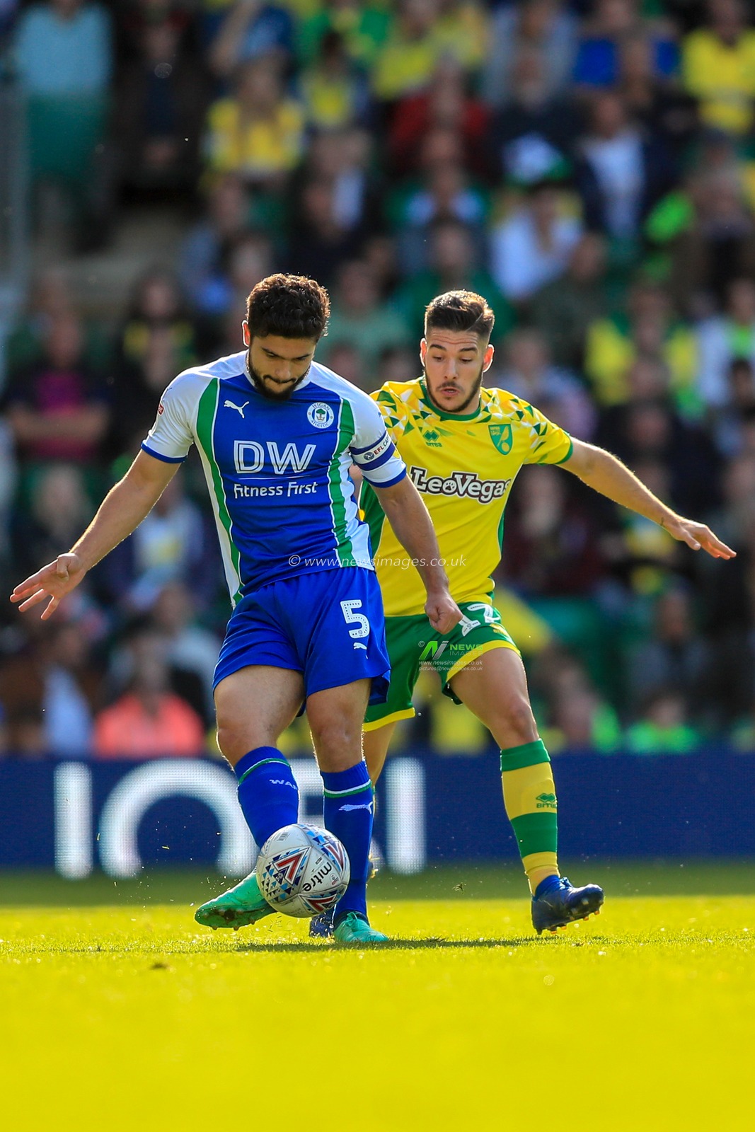 29th September 2018, Carrow Road, Norfolk, England; Sky Bet Championship, Norwich City v Wigan Athletic ;  Sam Morsy (05) of Wigan Athletic and Emiliano Buendia (17) of Norwich City tussle for the ball.


Credit:   Georgie Kerr/News Images

English Football League images are subject to DataCo Licence