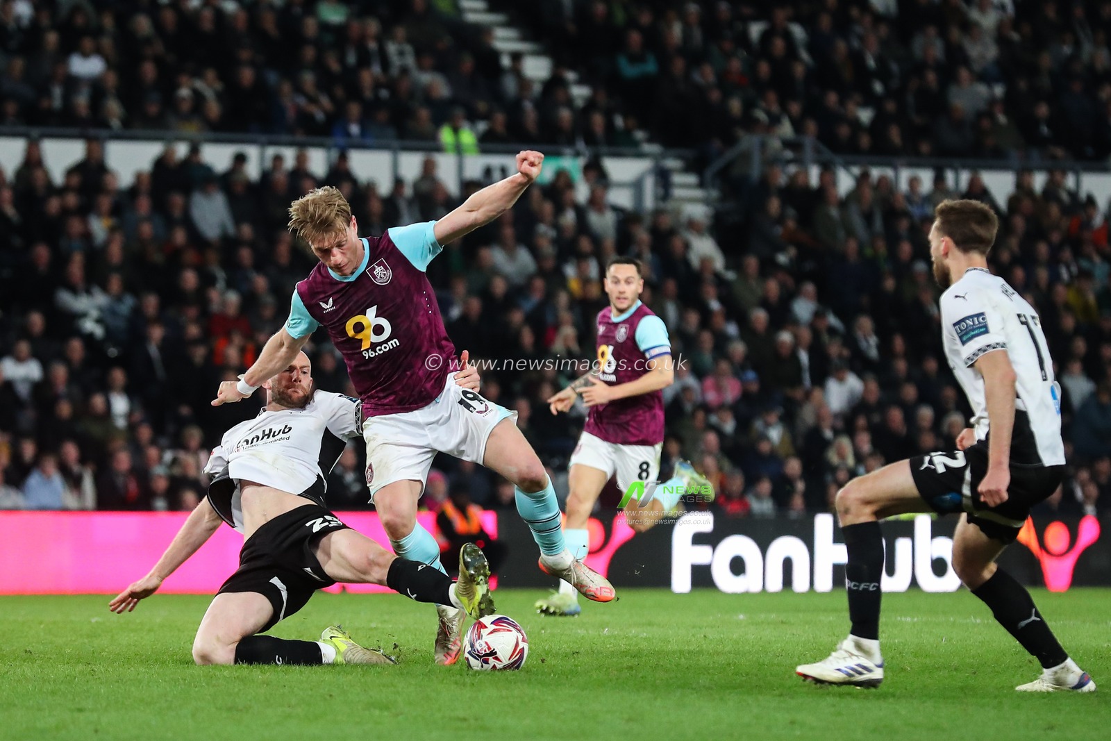 Matthew Clarke of Derby County tackles Zian Flemming of Burnley during the Sky Bet Championship match Derby County vs Burnley at Pride Park Stadium, Derby, United Kingdom, 8th April 2025

(Photo by Gareth Evans/News Images)