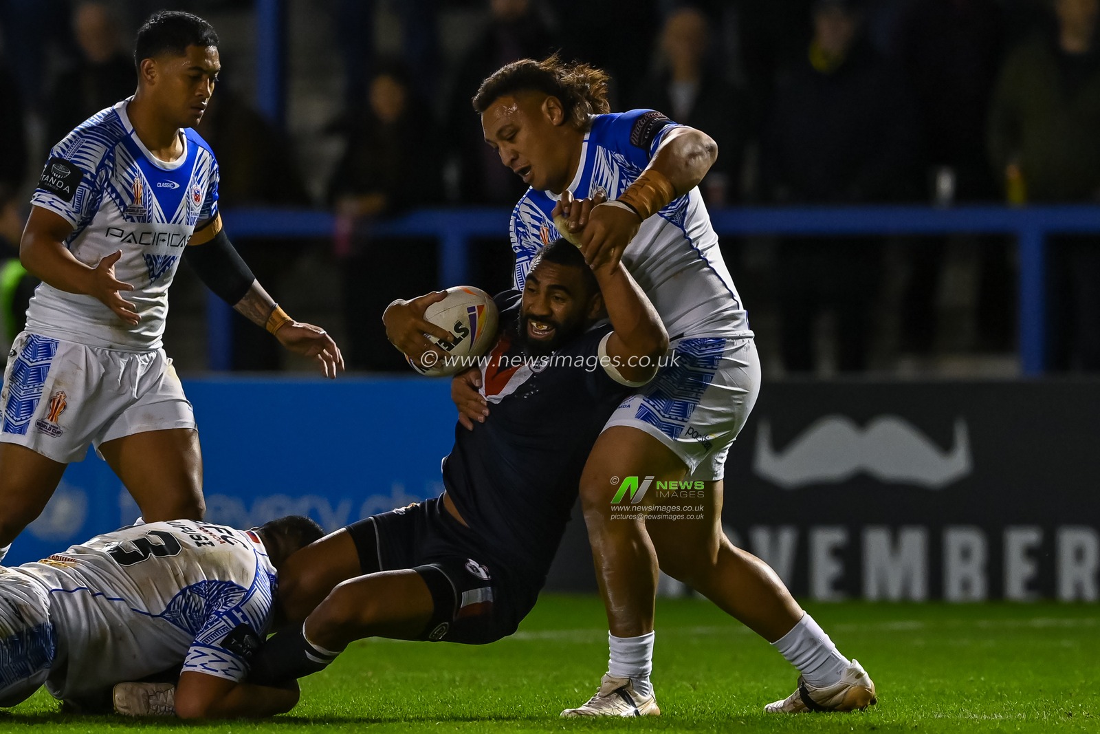 Samisoni Langi of France is tackled by Oregon Kaufusi and Josh Papalii of Samoa during the Rugby League World Cup 2021 Group A match Samoa vs France at Halliwell Jones Stadium, Warrington, United Kingdom, 30th October 2022

(Photo by Craig Thomas/News Images)