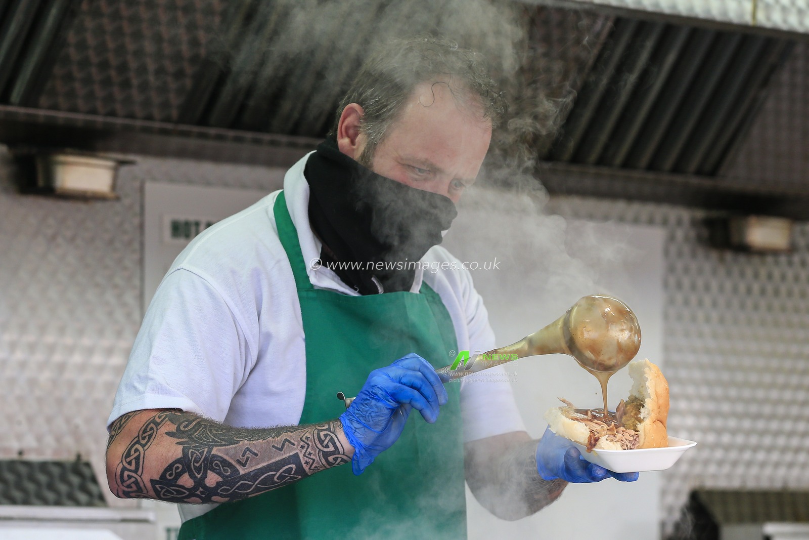 Food is being prepared for a fan as 1750 fans return to Kingston Park to host the Gallagher Premiership match between Newcastle Falcons and Northampton Saints