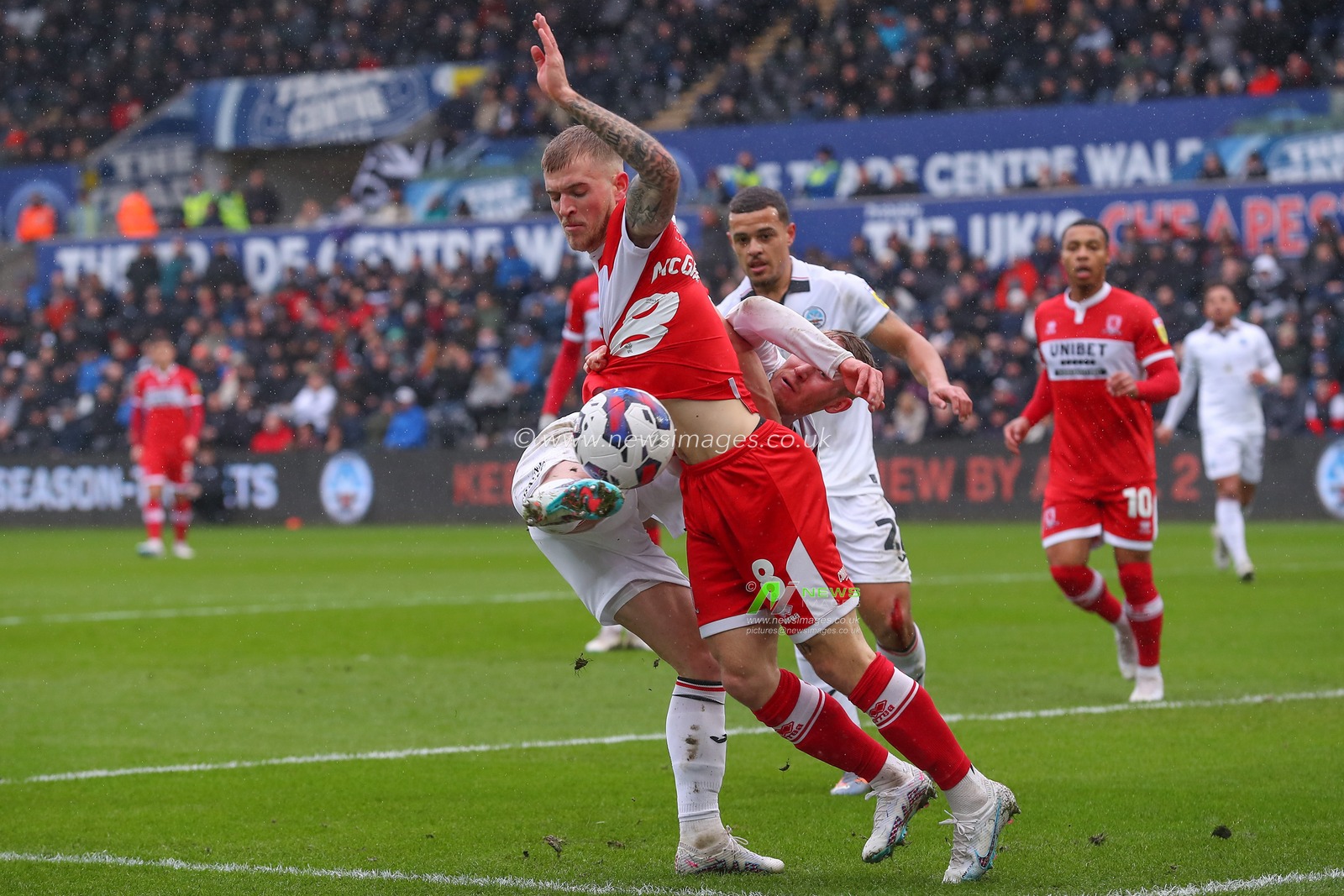 Ollie Cooper #31Â of Swansea City and Riley McGree #8 of Middlesbrough battle for the ball during the Sky Bet Championship match Swansea City vs Middlesbrough at Swansea.com Stadium, Swansea, United Kingdom, 11th March 2023

(Photo by Gareth Evans/News Images)