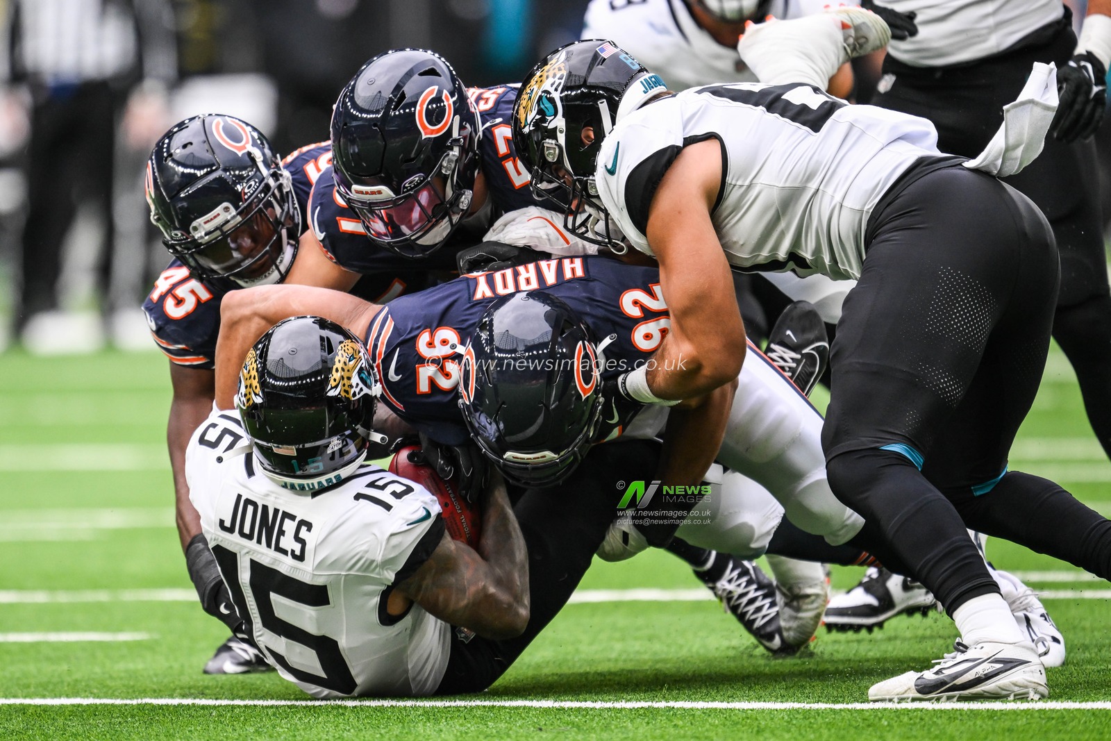 Tim Jones of the Jacksonville Jaguars is tackled by Daniel Hardy, Amen Ogbongbemiga and Jack Sanborn of the Chicago Bears during the Week 6 match Chicago Bears vs Jacksonville Jaguars at Tottenham Hotspur Stadium, London, United Kingdom, 13th October 2024

(Photo by Craig Thomas/News Images)