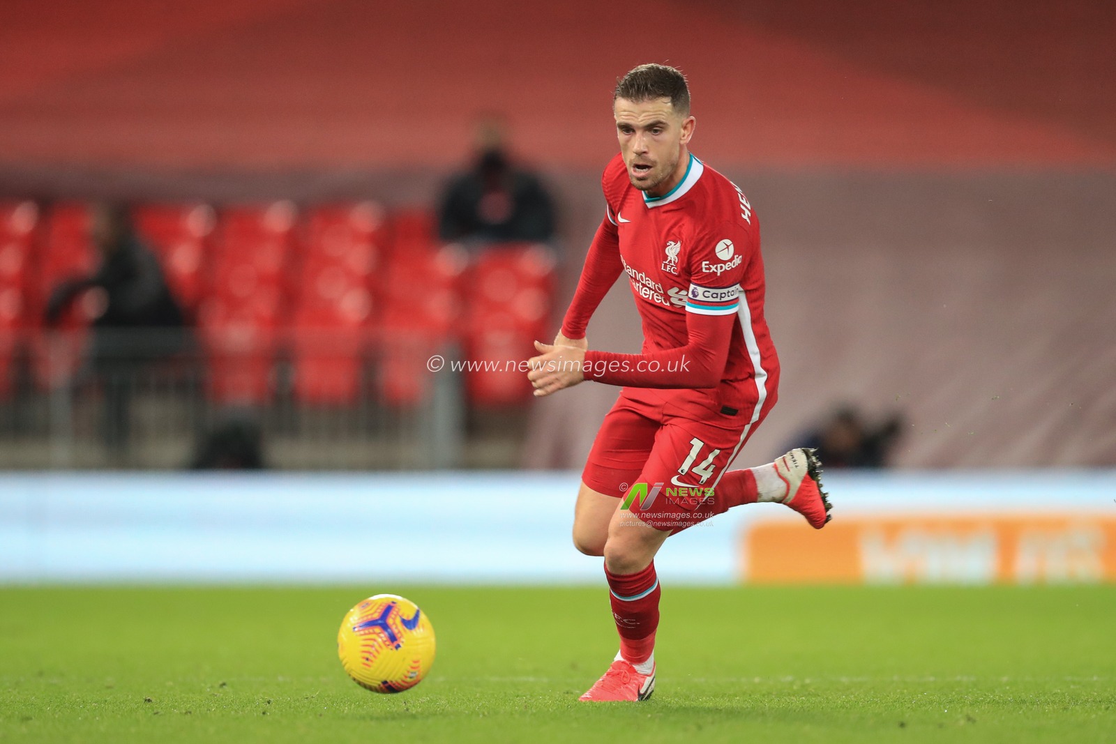 Jordan Henderson #14 of Liverpool in action during the game