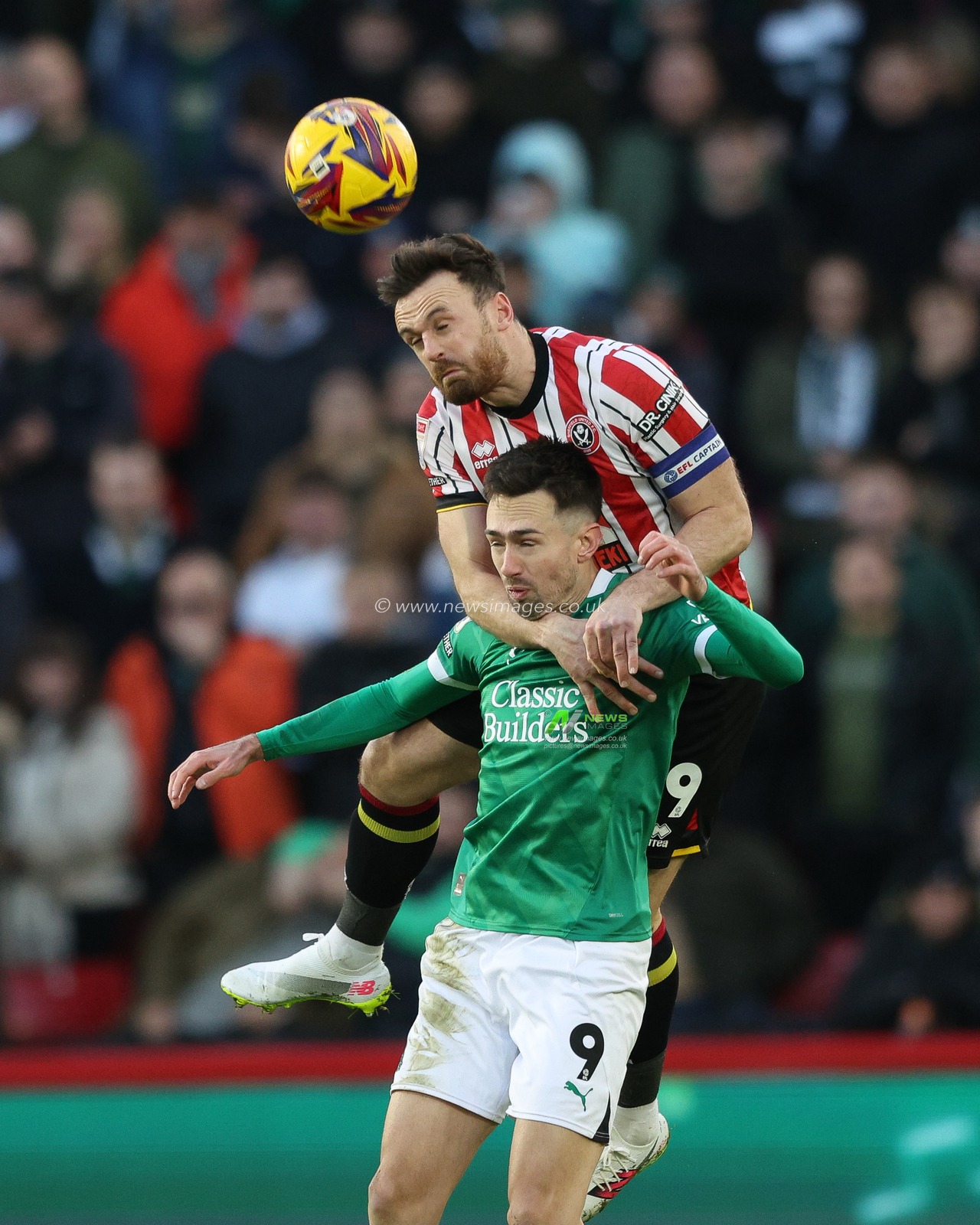 Jack Robinson of Sheffield United jumps up for a header against Ryan Hardie of Plymouth Argyle during the Sky Bet Championship match Sheffield United vs Plymouth Argyle at Bramall Lane, Sheffield, United Kingdom, 14th December 2024

(Photo by Alex Roebuck/News Images)