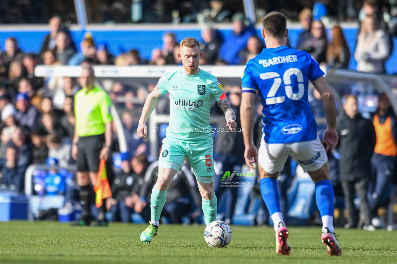 Lewis O'Brien #8 of Huddersfield Town looks for a way past Gary Gardner #20 of Birmingham City