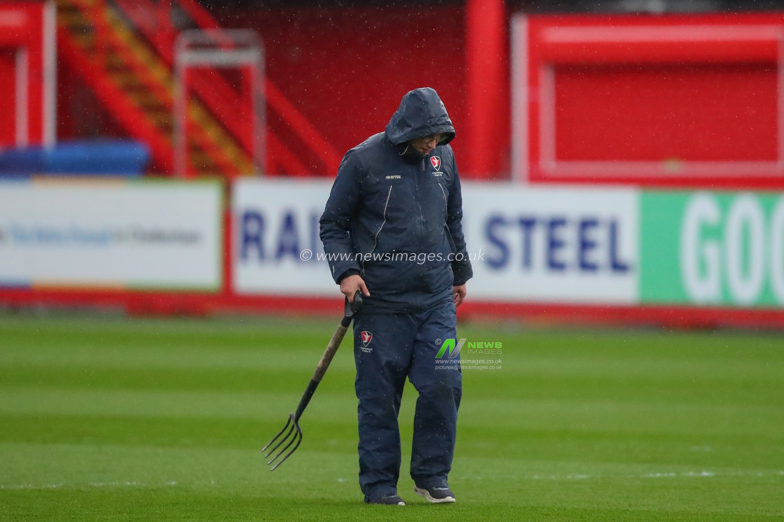 Cheltenham Town ground staff inspect the pitch ahead of kick off in the Sky Bet League 1 match Cheltenham Town vs Sheffield Wednesday at The Completely-Suzuki Stadium, Cheltenham, United Kingdom, 29th March 2023

(Photo by Gareth Evans/News Images)