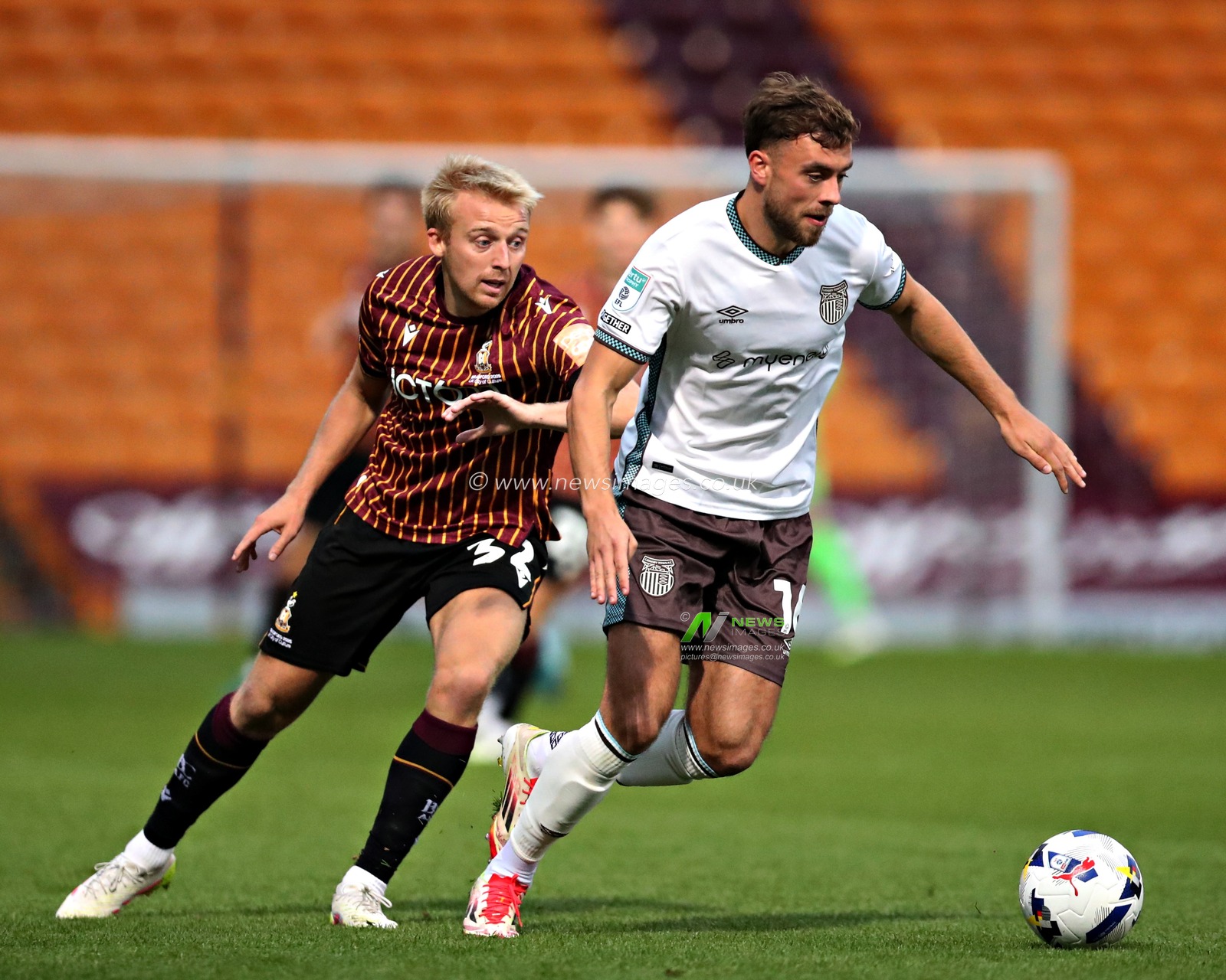 Reece Staunton of Grimsby Town is pressured by George Lapslie of Bradford City during the The Vertu Trophy match Bradford City vs Grimsby Town at University of Bradford Stadium, Bradford, United Kingdom, 2nd September 2025(Photo by Sam Eaden/News Images)