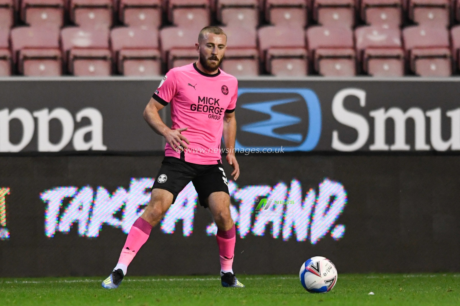 Dan Butler (3) of Peterborough United looks to control the ball