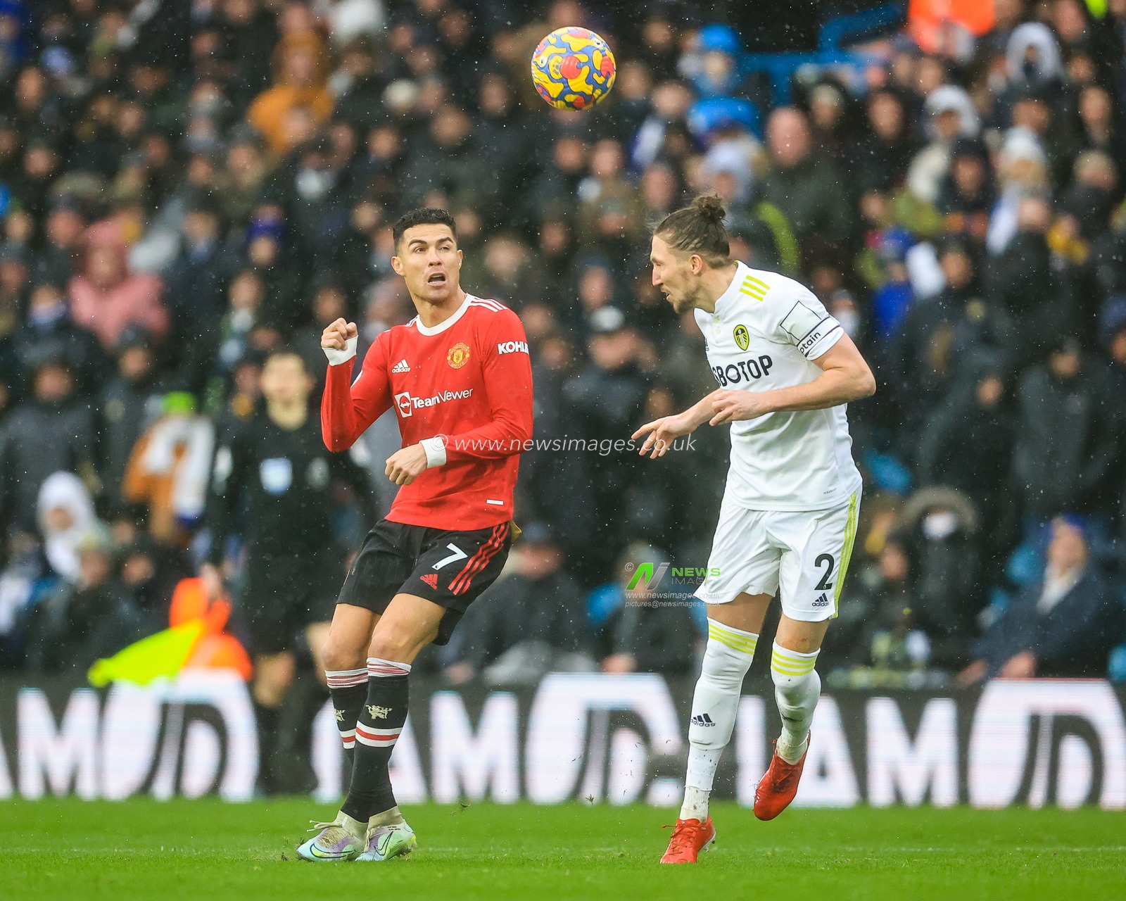 Luke Ayling #2 of Leeds United wins the header