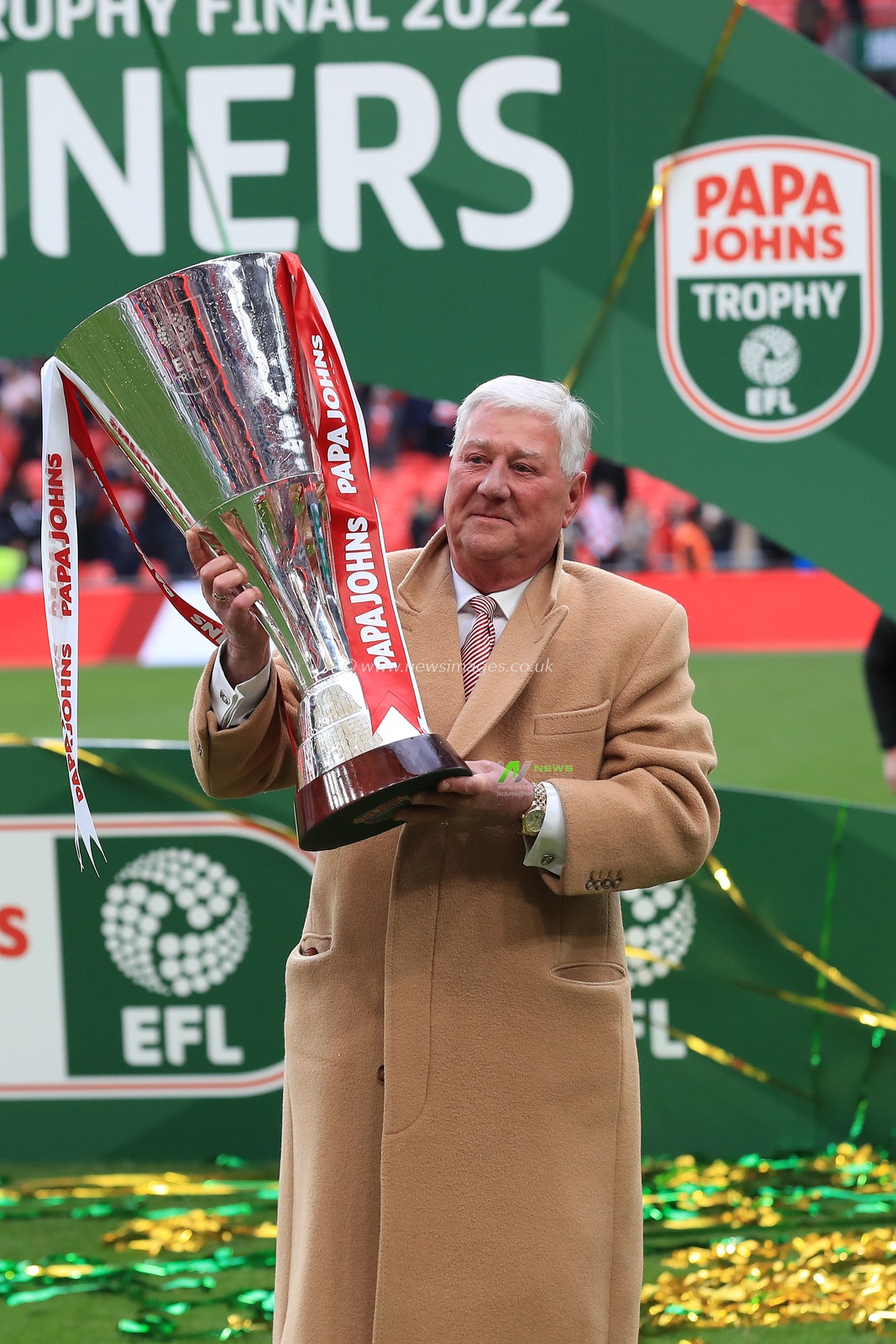 Rotherham United chairman Tony Stewart, poses with the trophy