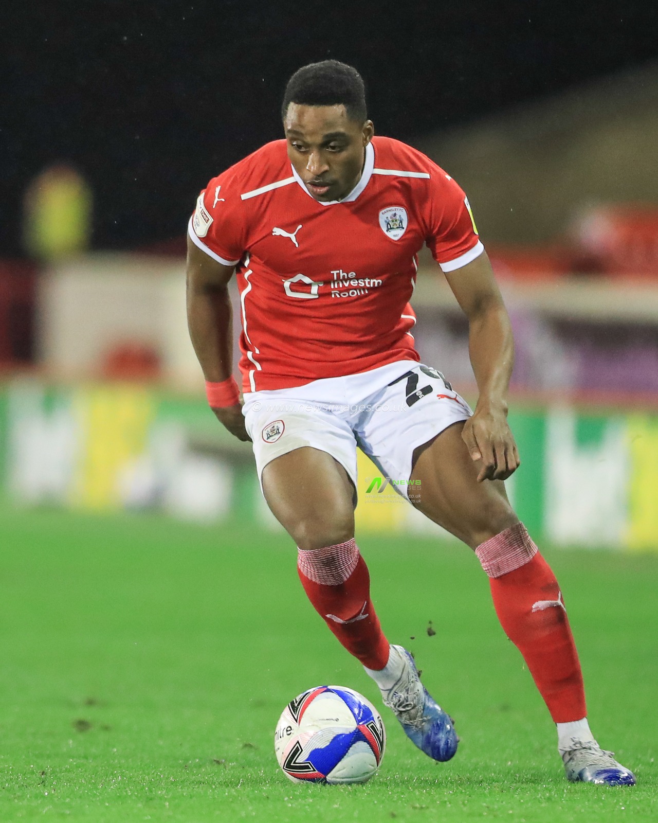 Victor Adeboyejo #29 of Barnsley in action during the game