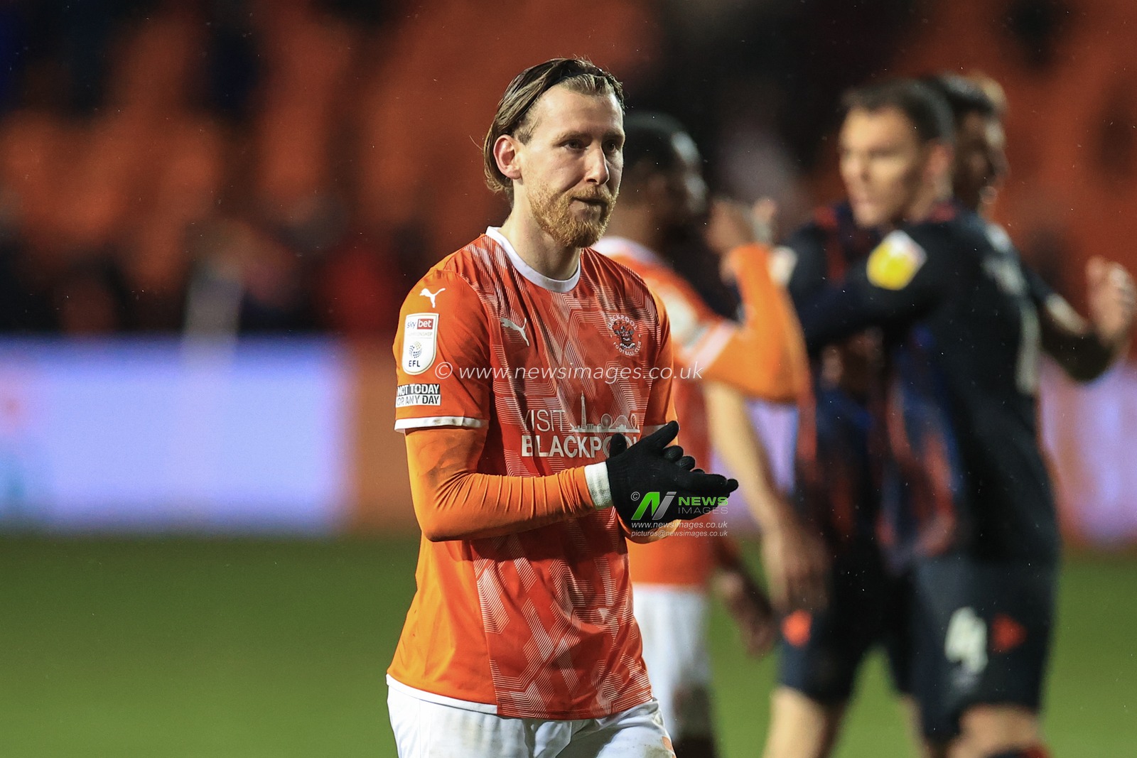 Josh Bowler #11 of Blackpool applauds the fans
