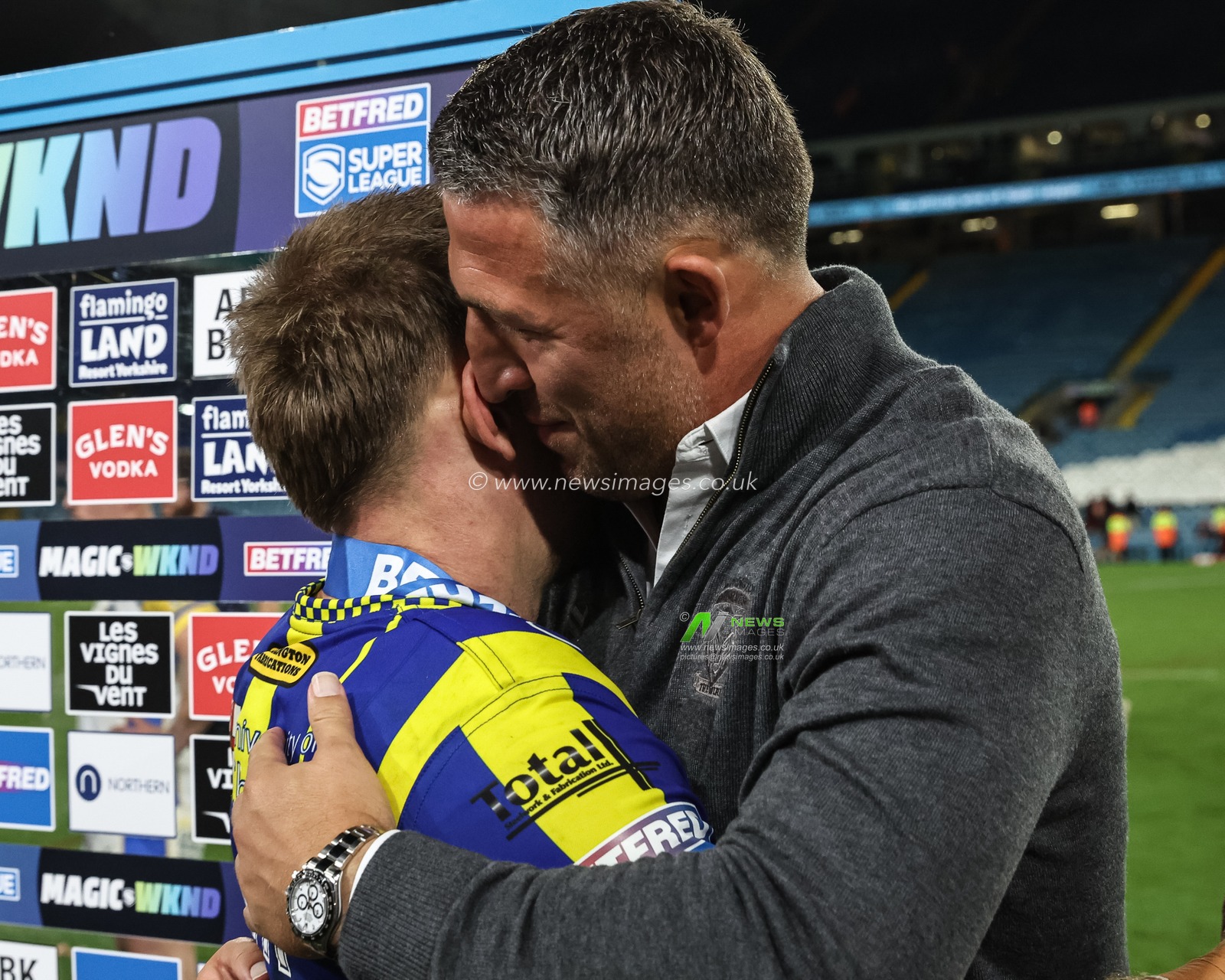 Sam Burgess Head Coach of Warrington Wolves embraces Matt Dufty of Warrington Wolves during the Magic Weekend match Warrington Wolves vs Leeds Rhinos at Elland Road, Leeds, United Kingdom, 17th August 2024

(Photo by Mark Cosgrove/News Images)