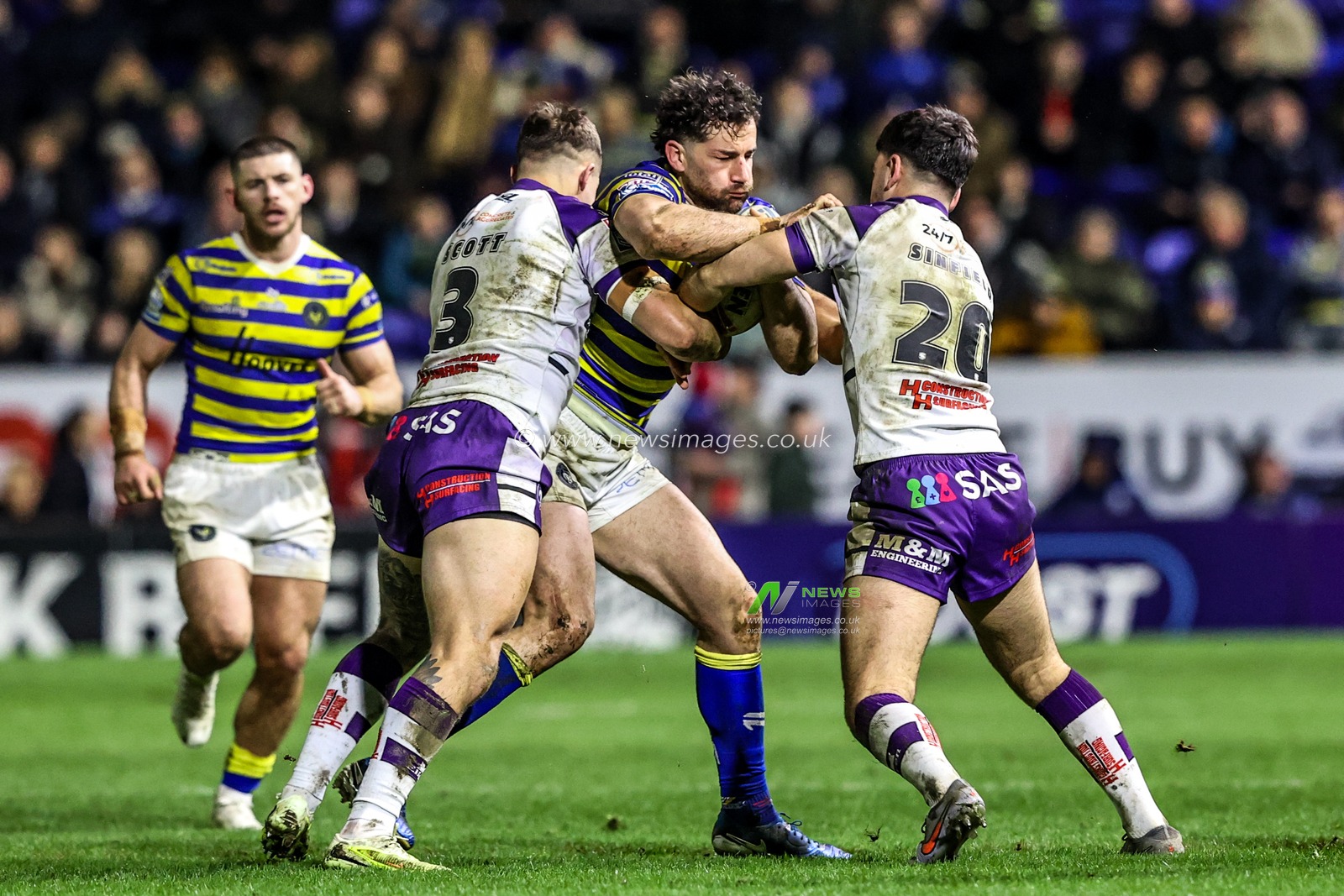 Toby King of Warrington Wolves is tackled by Cameron Scott of Wakefield Trinity and Jack Sinfield of Wakefield Trinity during the Betfred Super League Round 3 match Warrington Wolves vs Wakefield Trinity at The Halliwell Jones Stadium, Warrington, United Kingdom on 28 February 2026

(Photo by Alfie Cosgrove/News Images)