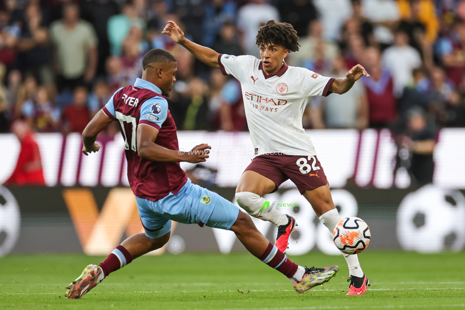 Rico Lewis of Manchester City is tackled by Lyle Foster of Burnley during the Premier League match Burnley vs Manchester City at Turf Moor, Burnley, United Kingdom, 11th August 2023

(Photo by Mark Cosgrove/News Images)