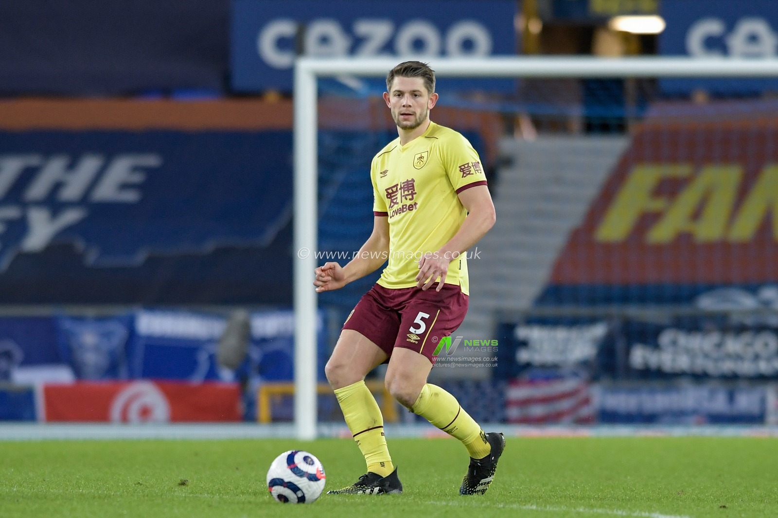 James Tarkowski #5 of Burnley passes the ball