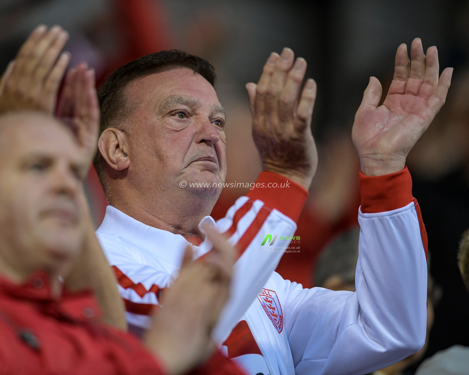 A Hull KR fan applauds his team after seeing them beat Leigh Centurions 28-34
