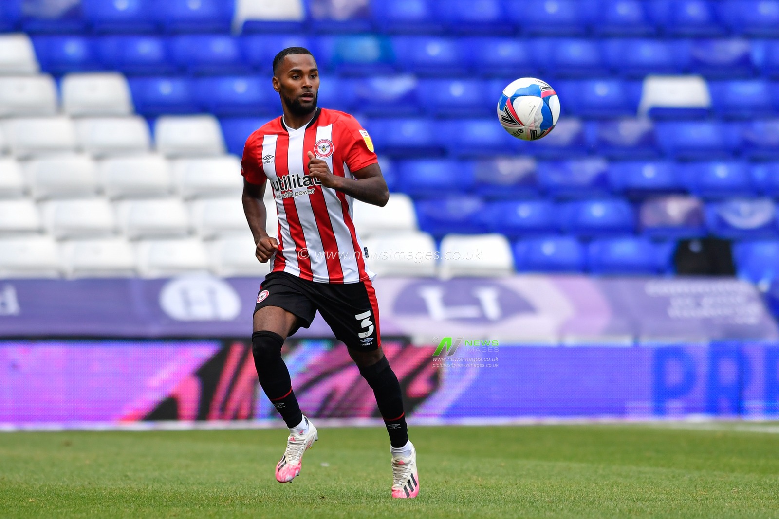Rico Henry (3) of Brentford chases the ball