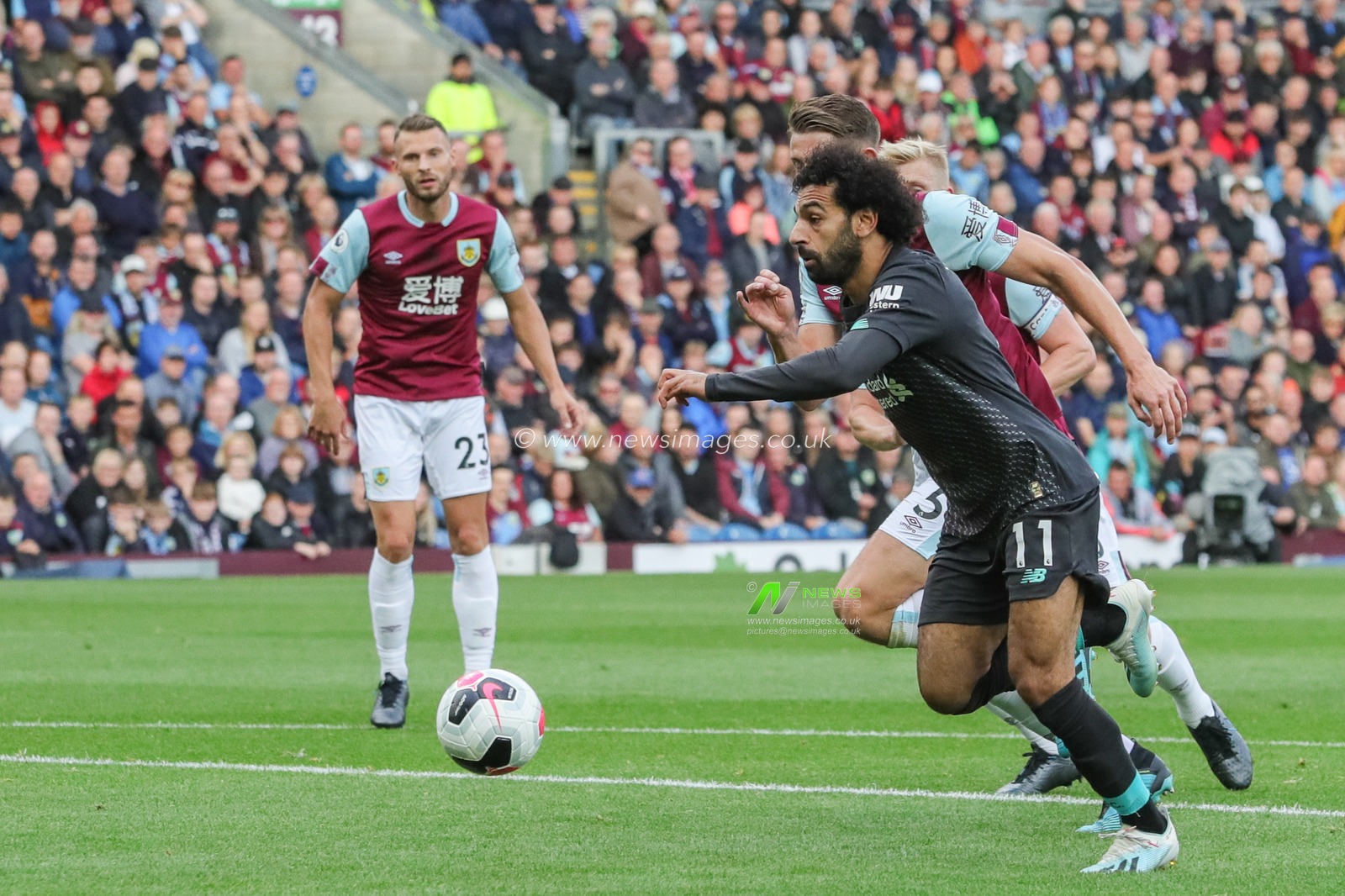 31st August 2019, Turf Moor, Burnley, England ; Premier League Football, Burnley vs Liverpool : Mohamed Salah (11) of Liverpool wins the ball in the area 

Credit: Mark Cosgrove/News Images

English Football League images are subject to DataCo Licence
