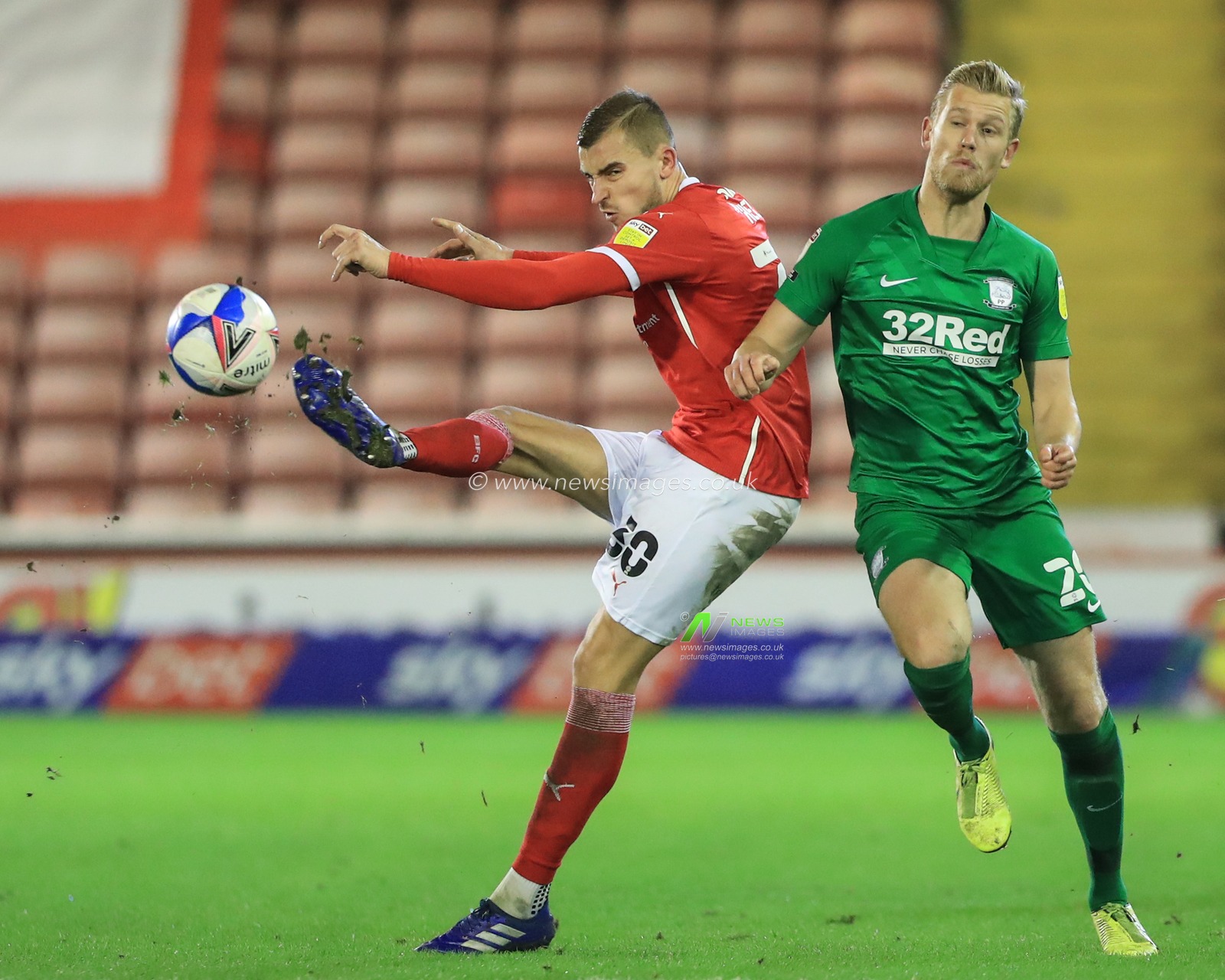 Michal Helik #30 of Barnsley clears the ball up field