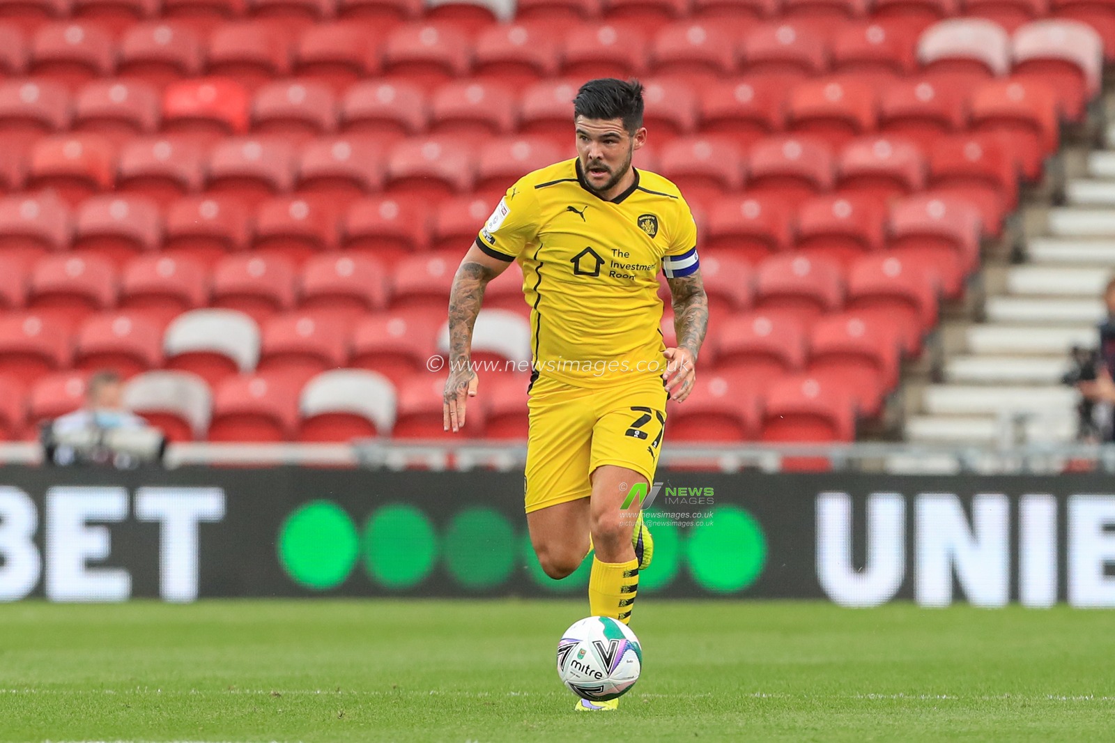 Alex Mowatt (captain) (27) of Barnsley in action during the game
