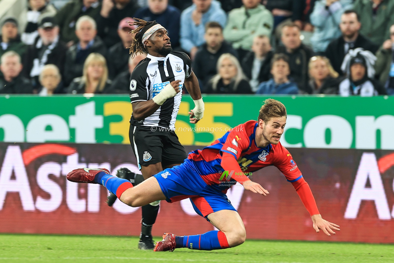 Allan Saint-Maximin #10 of Newcastle United fouls Joachim Andersen #16 of Crystal Palace