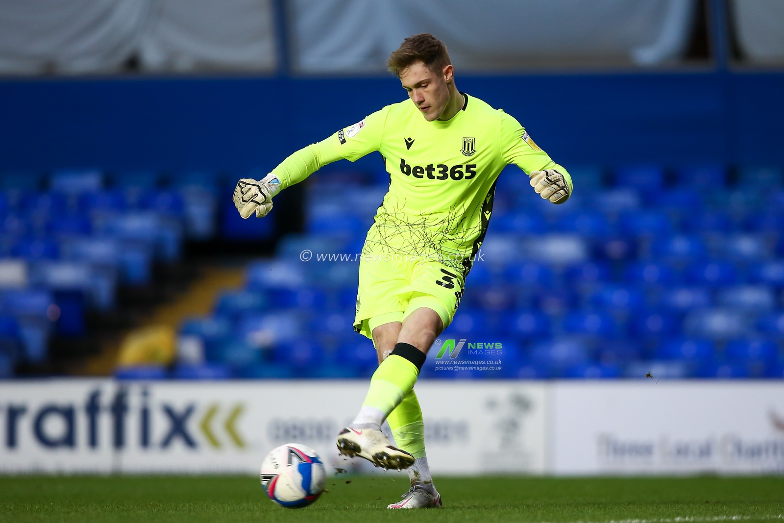 Josef Bursik #32 of Stoke City passes the ball