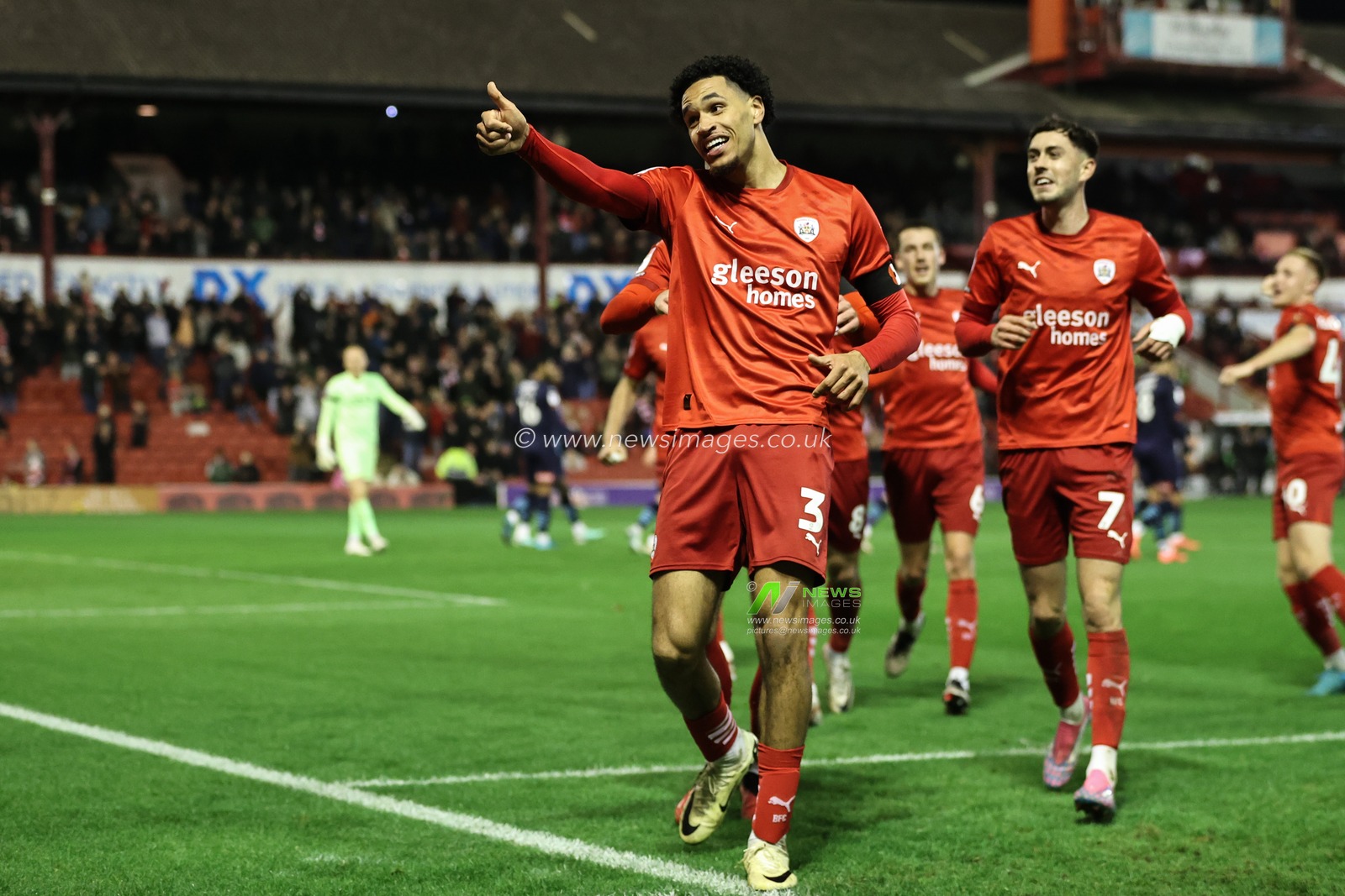 Jon Russell of Barnsley celebrates his goal to make it 1-0 during the Sky Bet League 1 match Barnsley vs Rotherham United at Oakwell, Barnsley, United Kingdom, 8th November 2024

(Photo by Alfie Cosgrove/News Images)