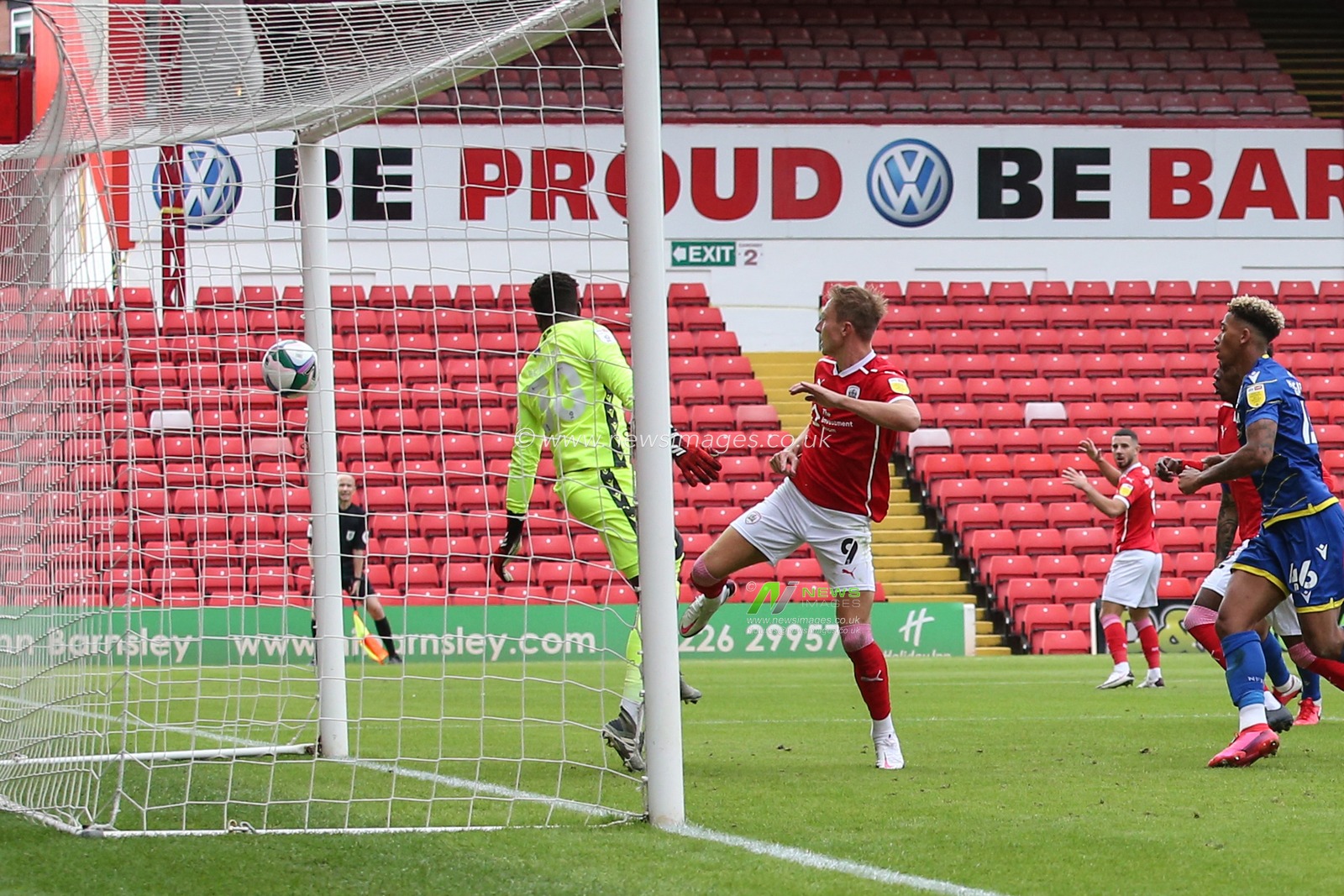 Cauley Woodrow (9) of Barnsley puts the ball in there net from close range