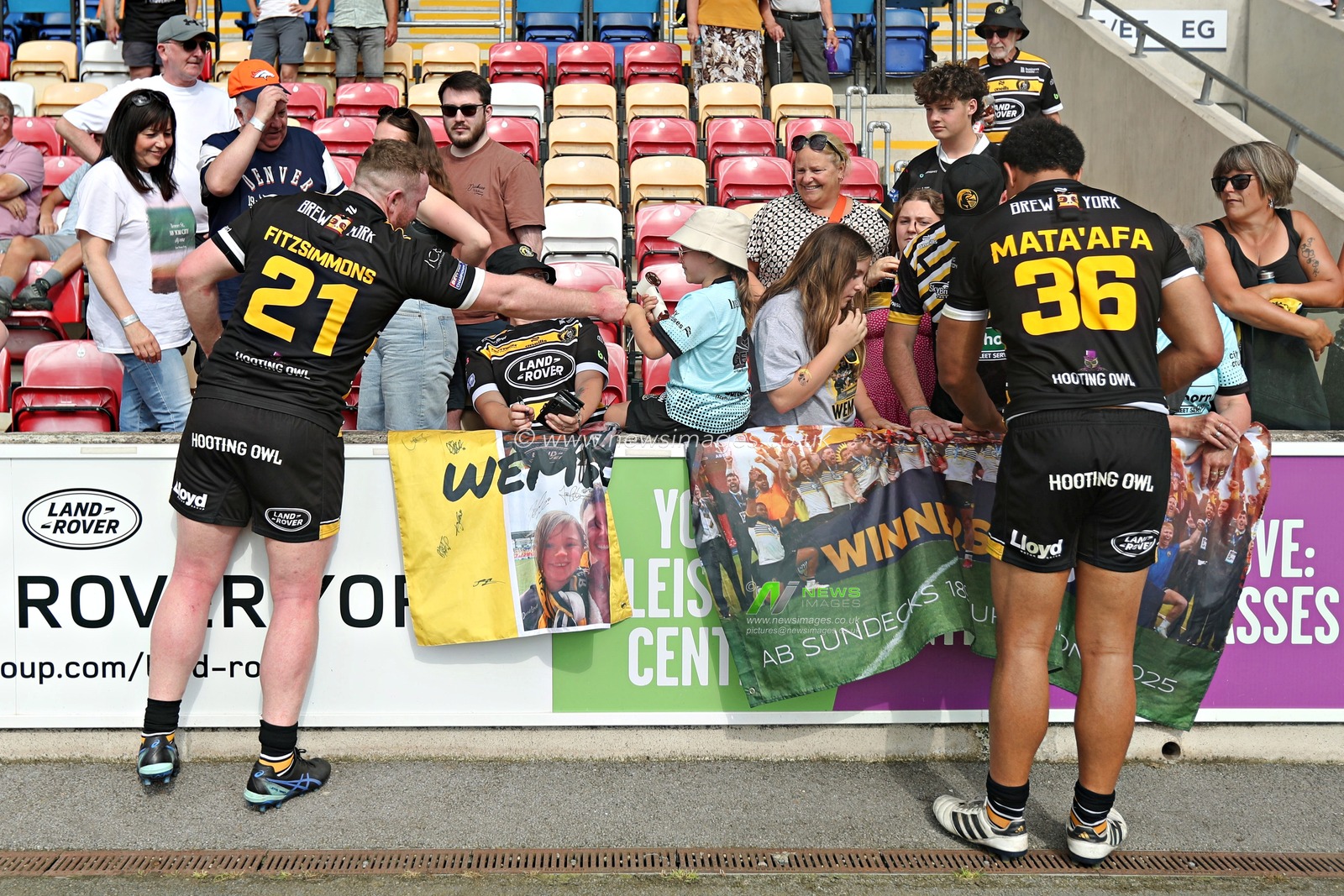 Connor Fitzsimmons of York Knights RLFC and Toa Mata'Afa of York Knights RLFC celebrate with fans after the Betfred Championship match York City Knights vs Featherstone Rovers at LNER Community Stadium, York, United Kingdom, 29th June 2025(Photo by Sam Eaden/News Images)