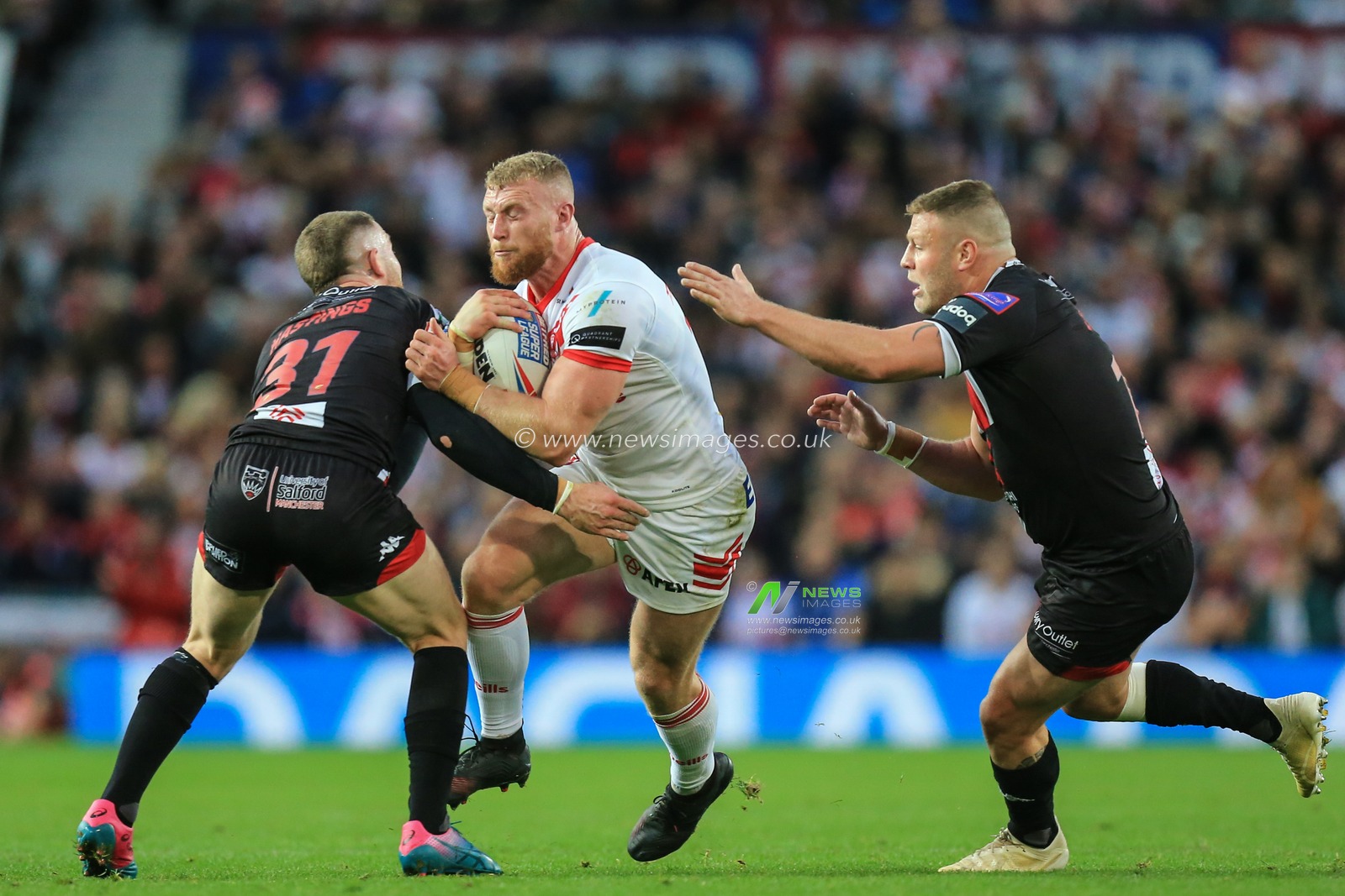 12th October 2019, Old Trafford, Manchester, England; The Grand Final 2019, Saint Helens v Salford Red Devils :Luke Thompson (10) of St Helens runs at Jackson Hastings (31) of Salford Red Devils 

Credit: David Greaves/News Images