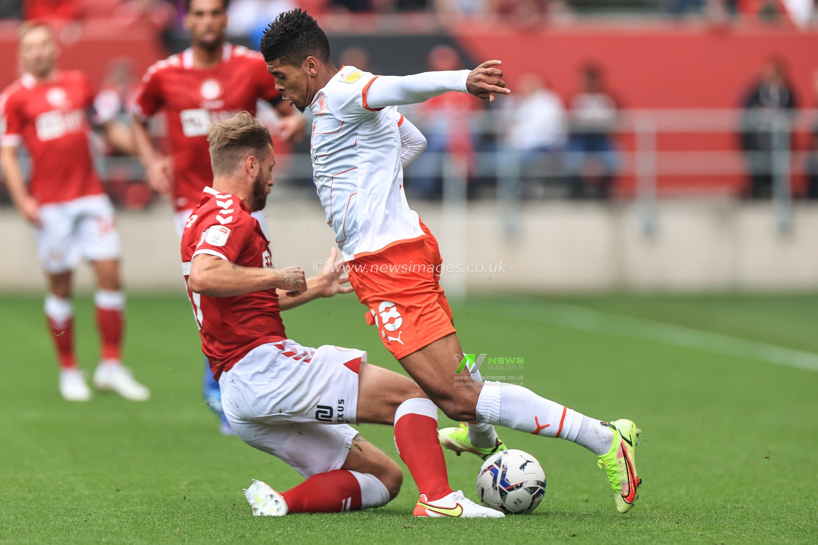 Tyreece John-Jules #28 of Blackpool is fouled by Nathan Barker #17 of Bristol City
