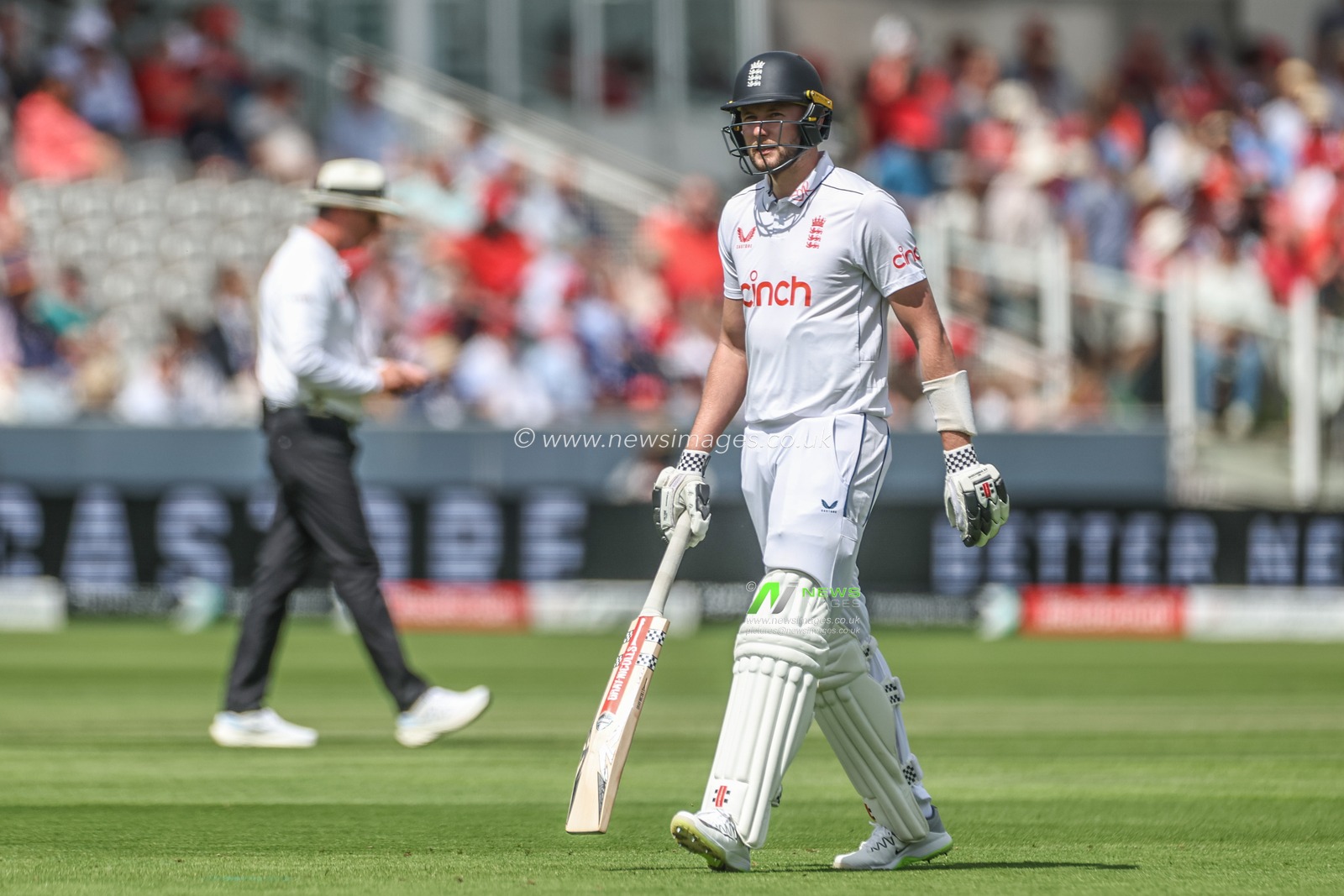 A dejected Gus Atkinson of England leaves the field of play after being bowled out for a golden duck during the Rothesay Test Match Day Two England v West Indies at Lords, London, United Kingdom, 11th July 2024

(Photo by Mark Cosgrove/News Images)