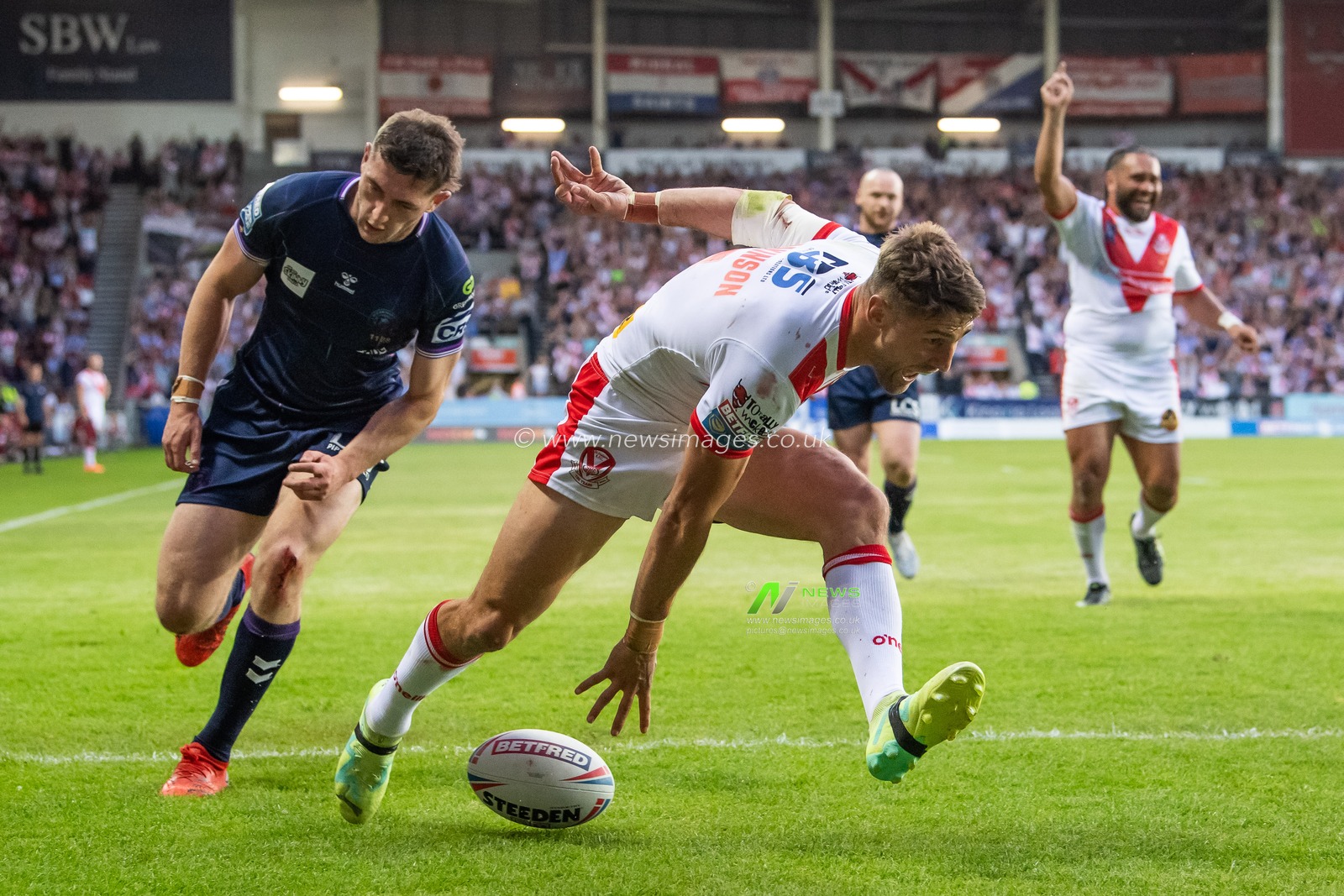 Tommy Makinson #2 of St Helens goes over for a try during the Betfred Super League Round 15 match St Helens vs Wigan Warriors at Totally Wicked Stadium, St Helens, United Kingdom, 9th June 2023

(Photo by Craig Thomas/News Images)