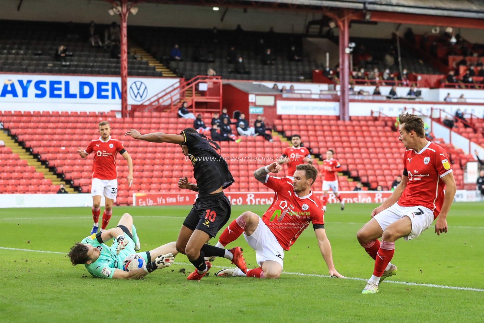 Jack Walton (1) of Barnsley saves a shot on goal from Joao Pedro (10) of Watford