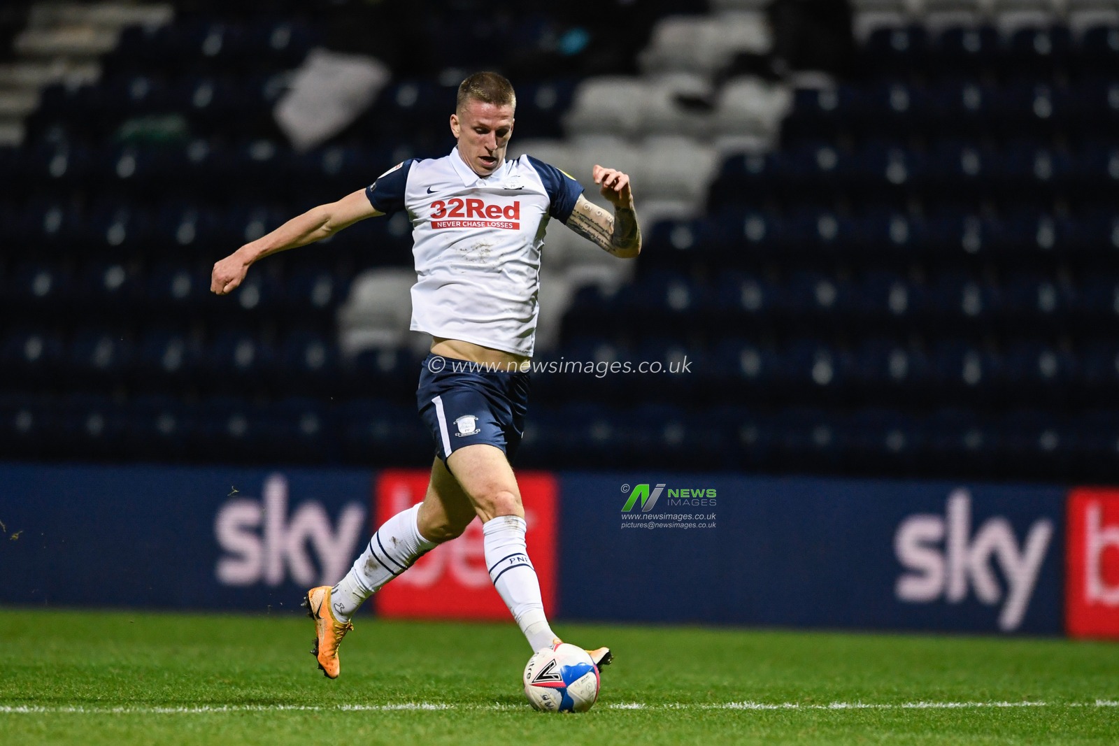 Emil Riis Jakobsen #19 of Preston North End runs forward with the ball