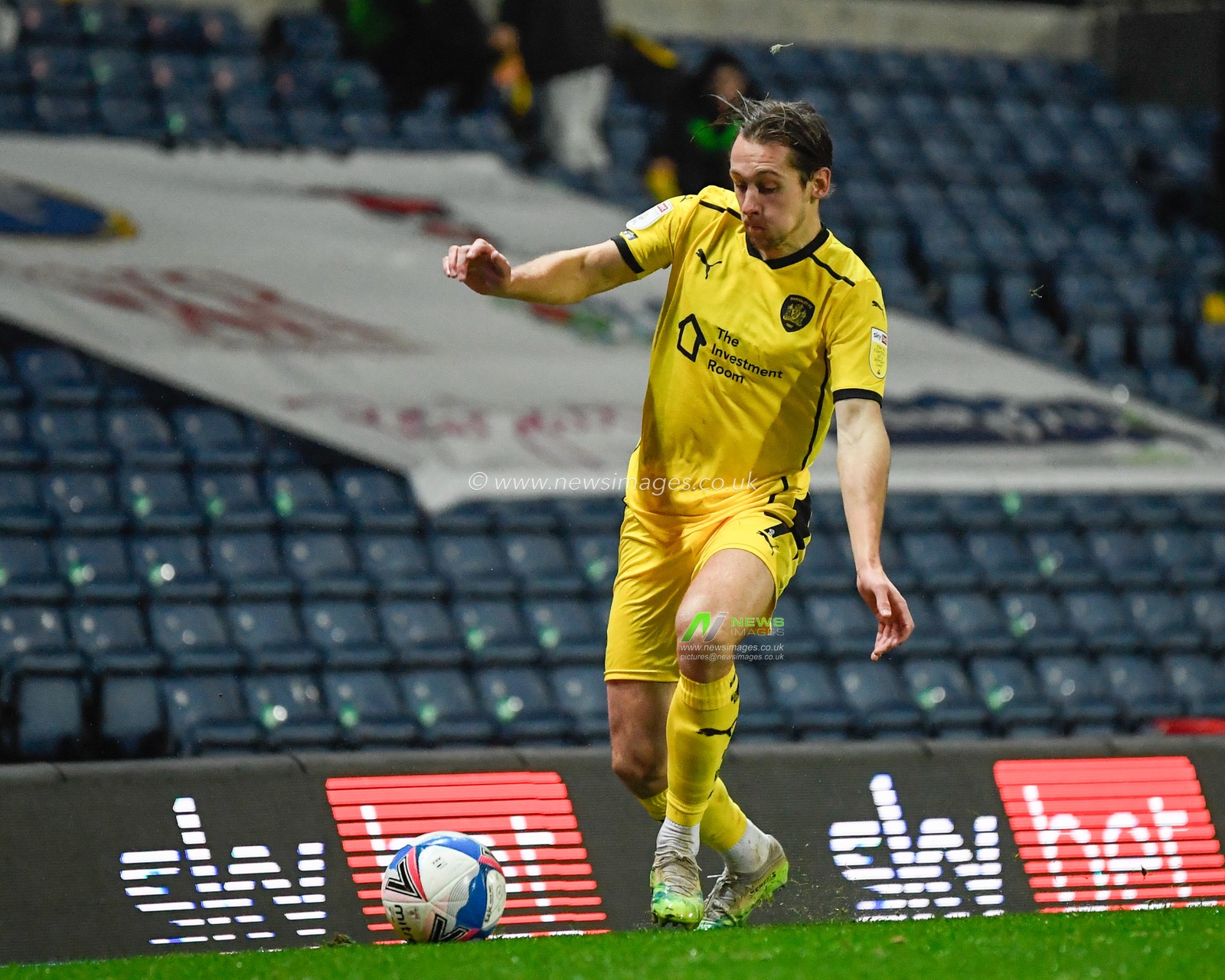 Callum Brittain #7 of Barnsley with the ball