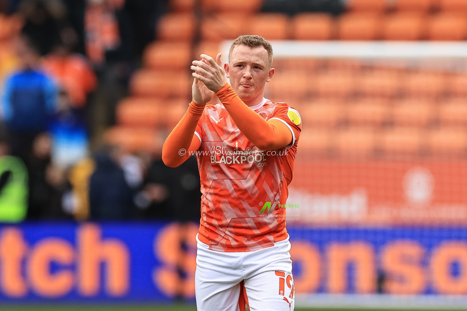 Shayne Lavery #19 of Blackpool applauds the fans