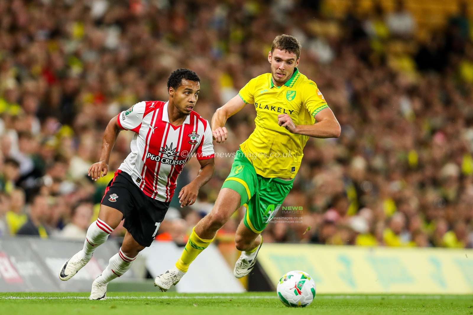 Cameron Archer of Southampton is put under pressure by Ruairi Mcconville of Norwich City during the Carabao Cup match Norwich City vs Southampton at Carrow Road, Norwich, United Kingdom, 26th August 2025

(Photo by Izzy Poles/News Images)