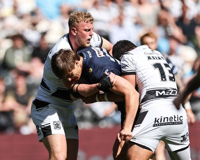 Harvey Makin of Wigan Warriors is tackled by Jack Ashworth of Hull FC and John Asiata of Hull FC during the Betfred Super League Round 9 match Hull FC vs Wigan Warriors at MKM Stadium, Hull, United Kingdom, 27th April 2025

(Photo by Mark Cosgrove/News Images)