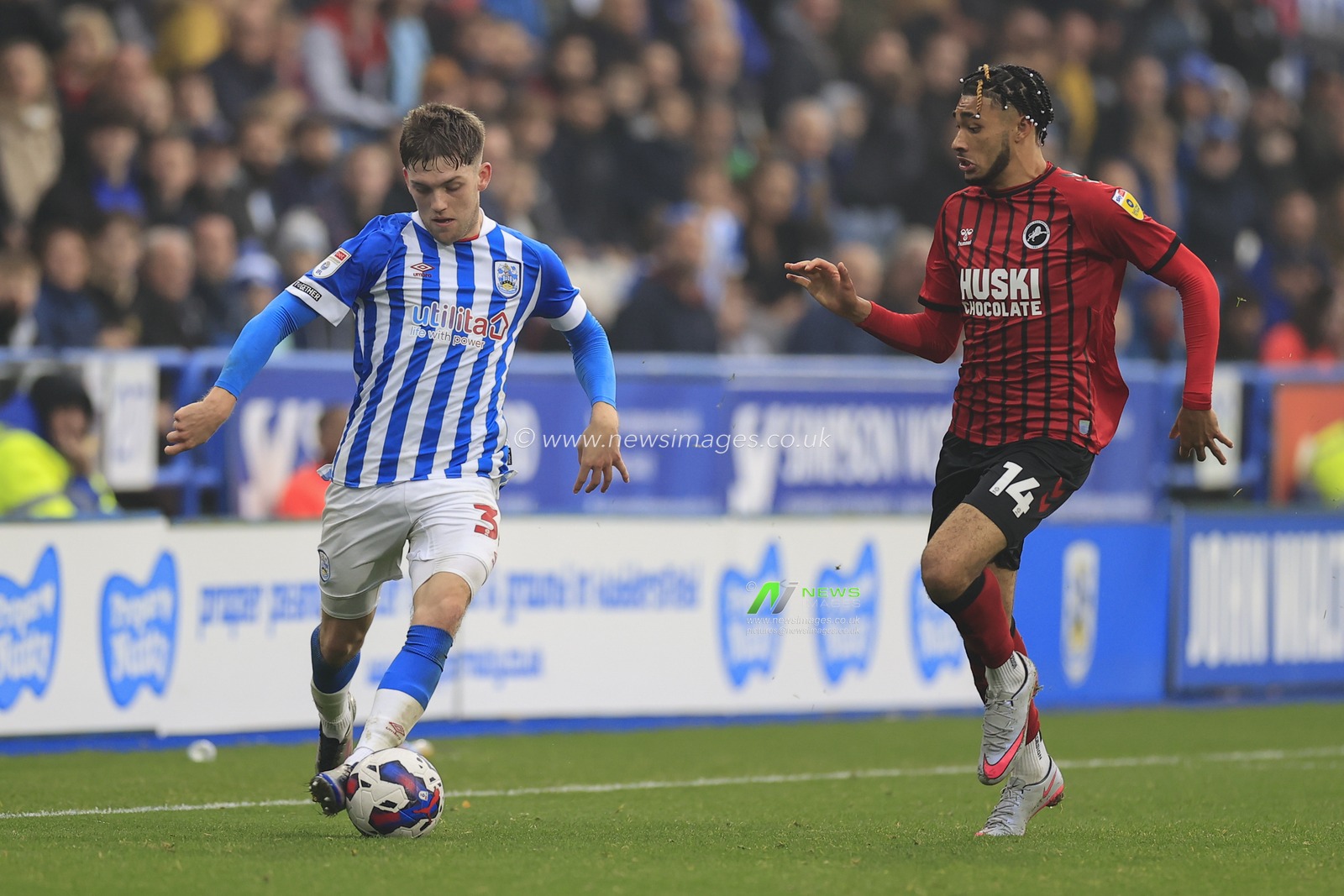 Ben Jackson #30 of Huddersfield Town tries to get past Tyler Burey #14 of Millwall during the Sky Bet Championship match Huddersfield Town vs Millwall at John Smith's Stadium, Huddersfield, United Kingdom, 29th October 2022

(Photo by Conor Molloy/News Images)