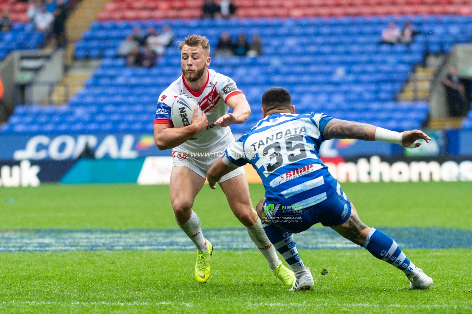 27th July 2019 , University of Bolton Stadium, Bolton, England; 2019 Coral Challenge Cup Semi-Final, St Helens vs Halifax RLFC ; Danny Richardson of St Helens out steps the challenge of Adam Tangata of Halifax 


Credit: Richard Long/News Images