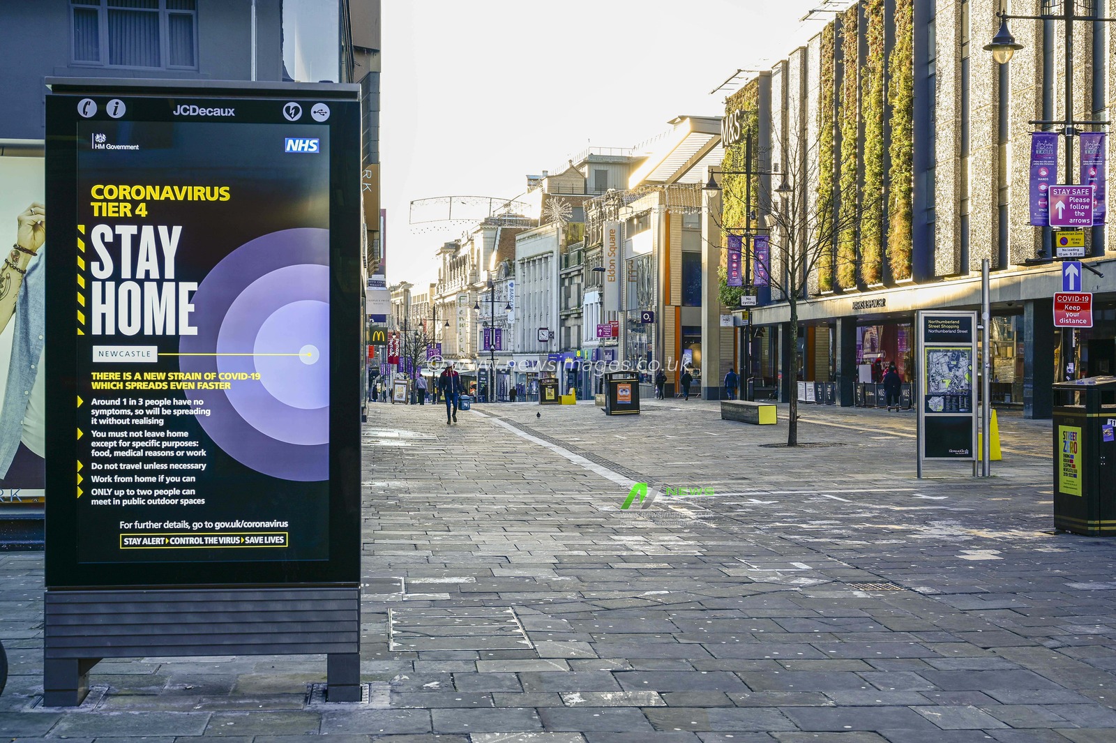 Northumberland Street in Newcastle upon Tyne on New Year's Eve, looking quiet during the first day of Tier 4 National Covid-19 restrictions. A sign explains that the city is now under Tier 4 National Covid-19 restrictions.