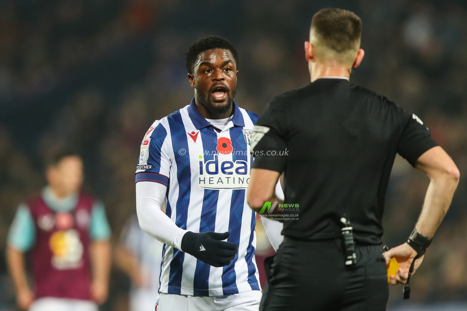 Josh Maja of West Bromwich Albion talks to referee Tom Nield after he is shown a yellow card during the Sky Bet Championship match West Bromwich Albion vs Burnley at The Hawthorns, West Bromwich, United Kingdom, 7th November 2024

(Photo by Gareth Evans/News Images)
