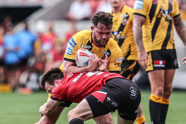 Bradley Singleton of Castleford Tigers is tackled during the Betfred Super League Round 18 match Salford Red Devils vs Castleford Tigers at Salford Community Stadium, Eccles, United Kingdom, 13th July 2025

(Photo by Alfie Cosgrove/News Images)