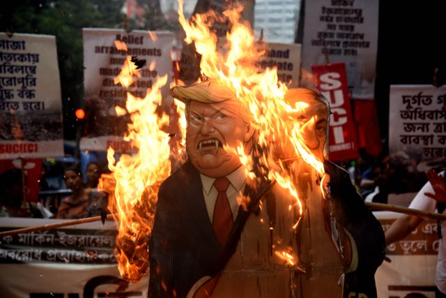 Activists of Social Unity Center of India (SUCI) hold placards and an effigy of US President Donald Trump and Israel's Prime Minister Benjamin Netanyahu during a protest against Western policy in the Israel-Hamas conflict, near US Embassy in Kolkata, Eastern India, 07 October 2025.Photo by Debajyoti Chakraborty.(Photo: Debajyoti Chakraborty/News Images)
