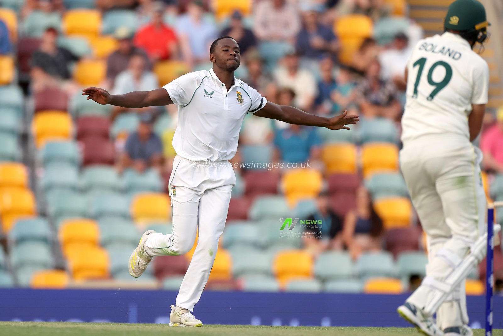 Kagiso Rabada of South Africa dismisses Scott Boland of Australia  and celebrates during the NRMA Insurance test Series match Australia vs South Africa at The Gabba, Brisbane Cricket Ground, Brisbane, Australia, 17th December 2022

(Photo by Patrick Hoelscher/News Images)